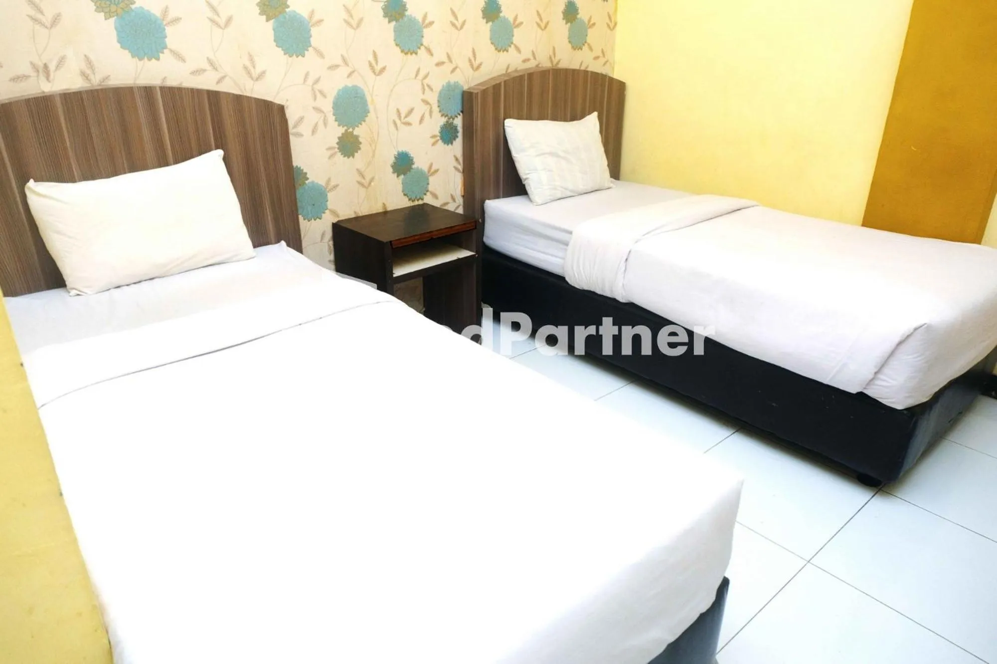 Bed in Hotel Permata Makassar Mitra RedDoorz