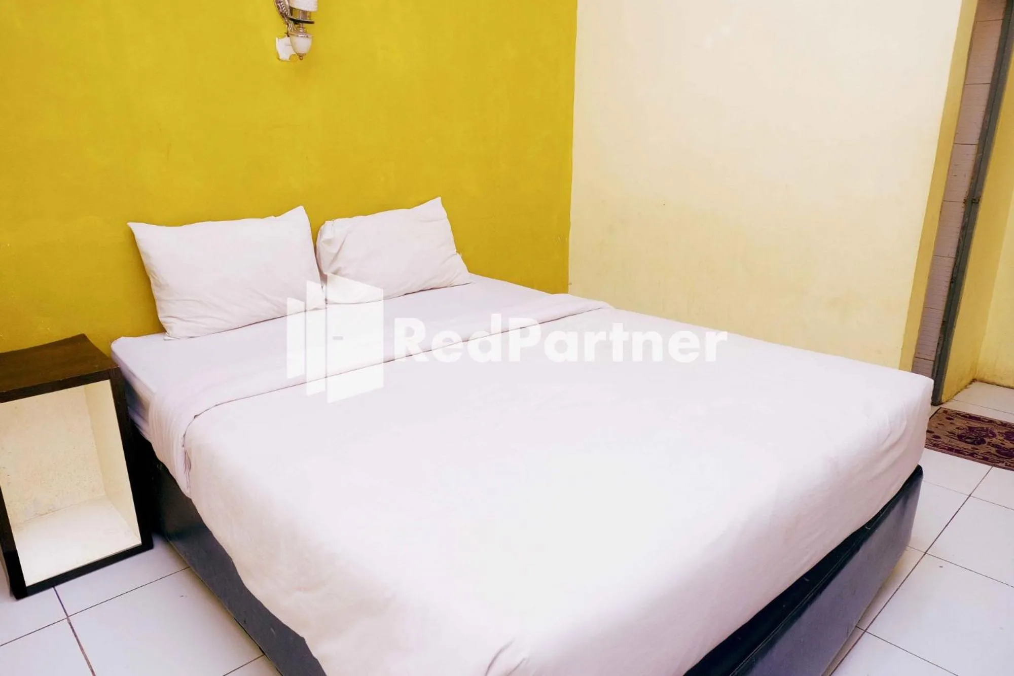 Bed in Hotel Permata Makassar Mitra RedDoorz