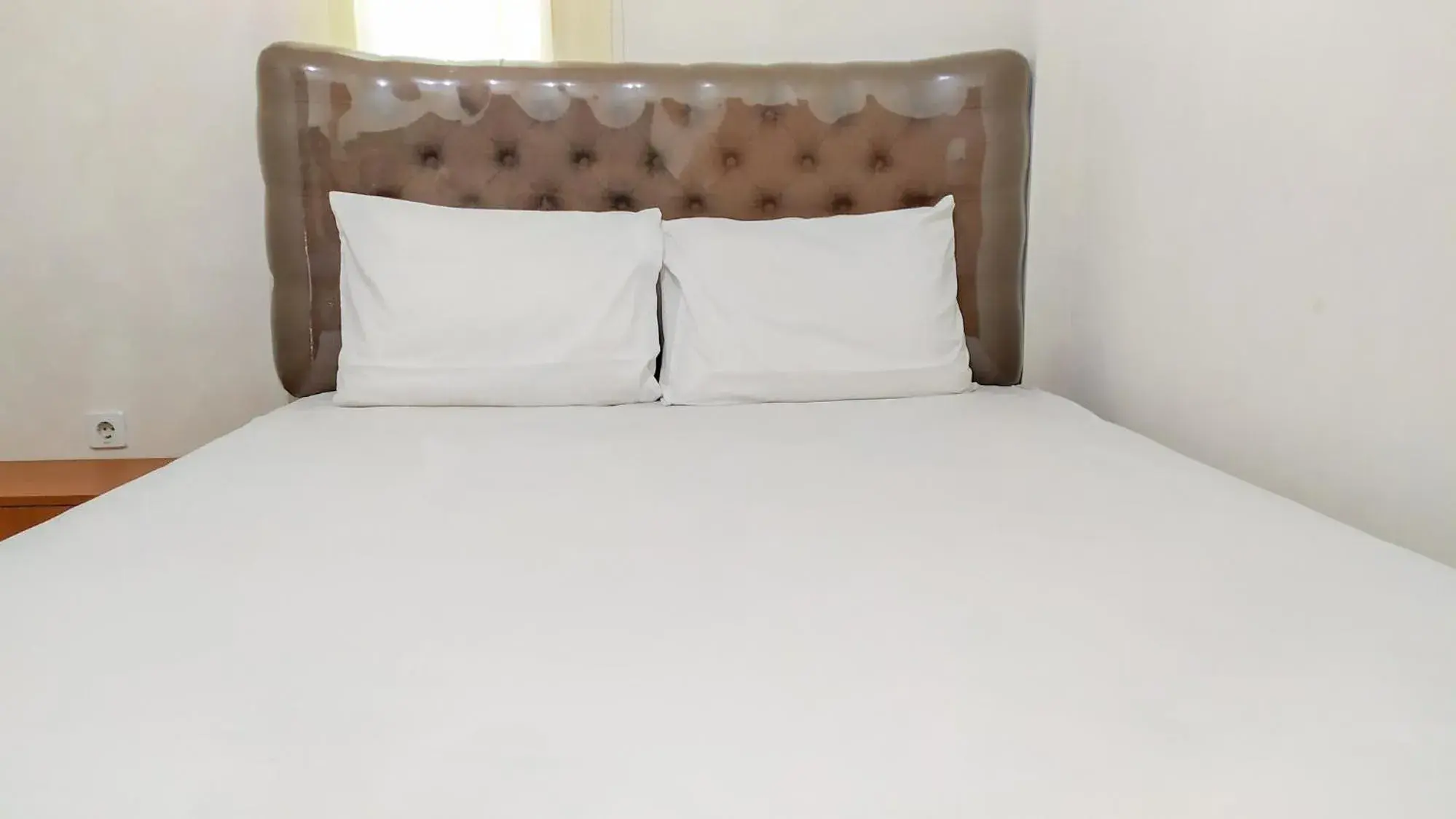 Bed in Omah Leren Mitra RedDoorz near Gembiraloka Zoo Yogyakarta Bed in Omah Leren Mitra RedDoorz near Gembiraloka Zoo Yogyakarta