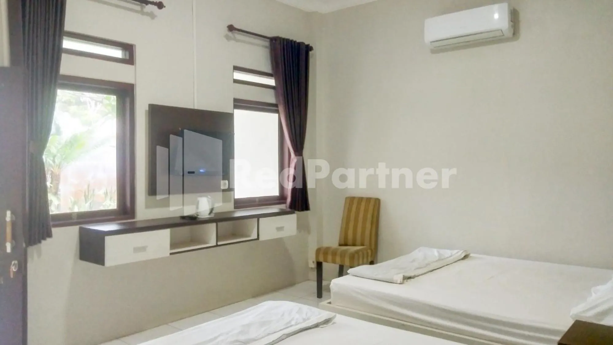 Bed in The SO Hotel Mitra RedDoorz