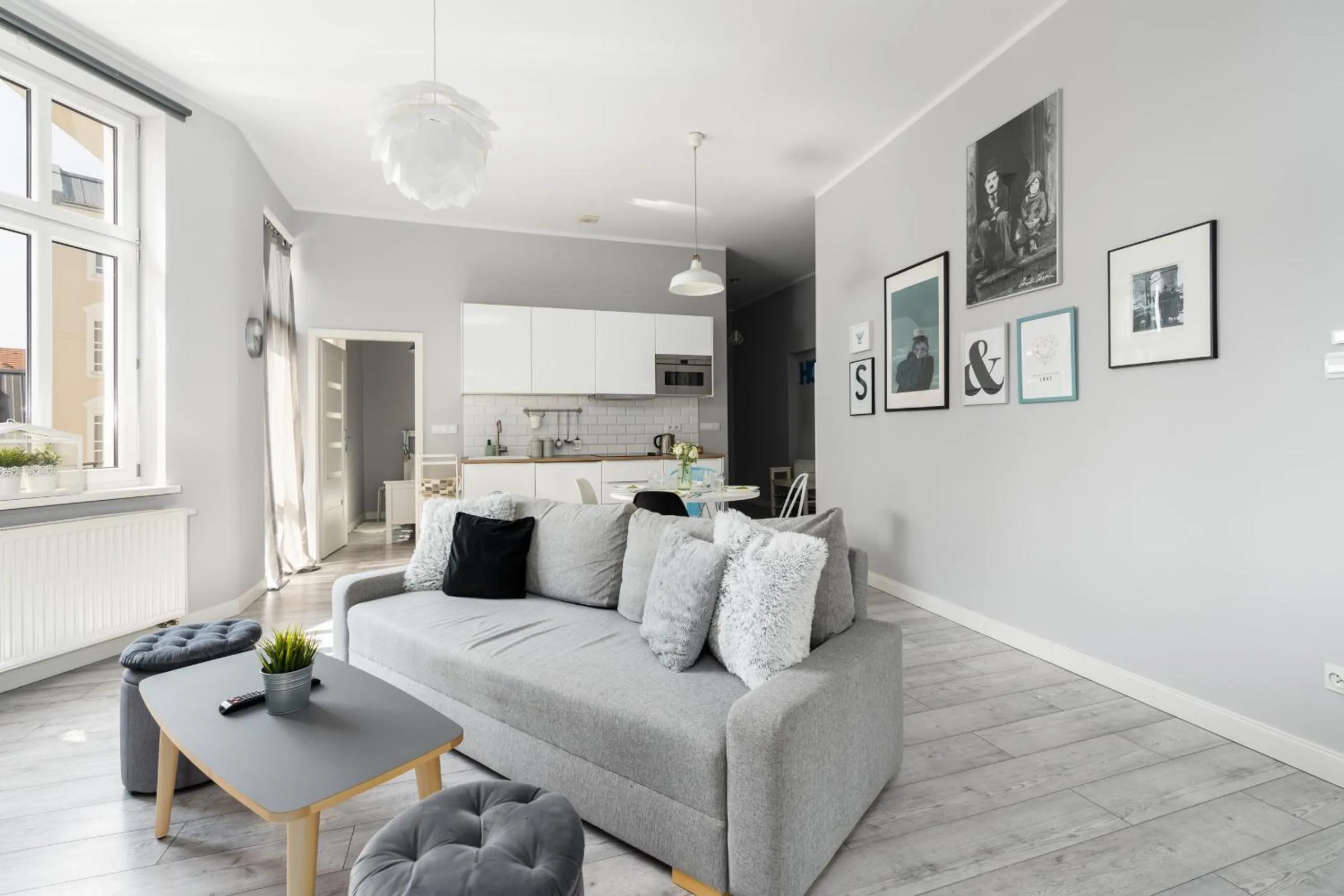 Communal lounge/ TV room in Scandi Małe Garbary Apartment Piaskowa near Old Market Square by Noclegi Renters