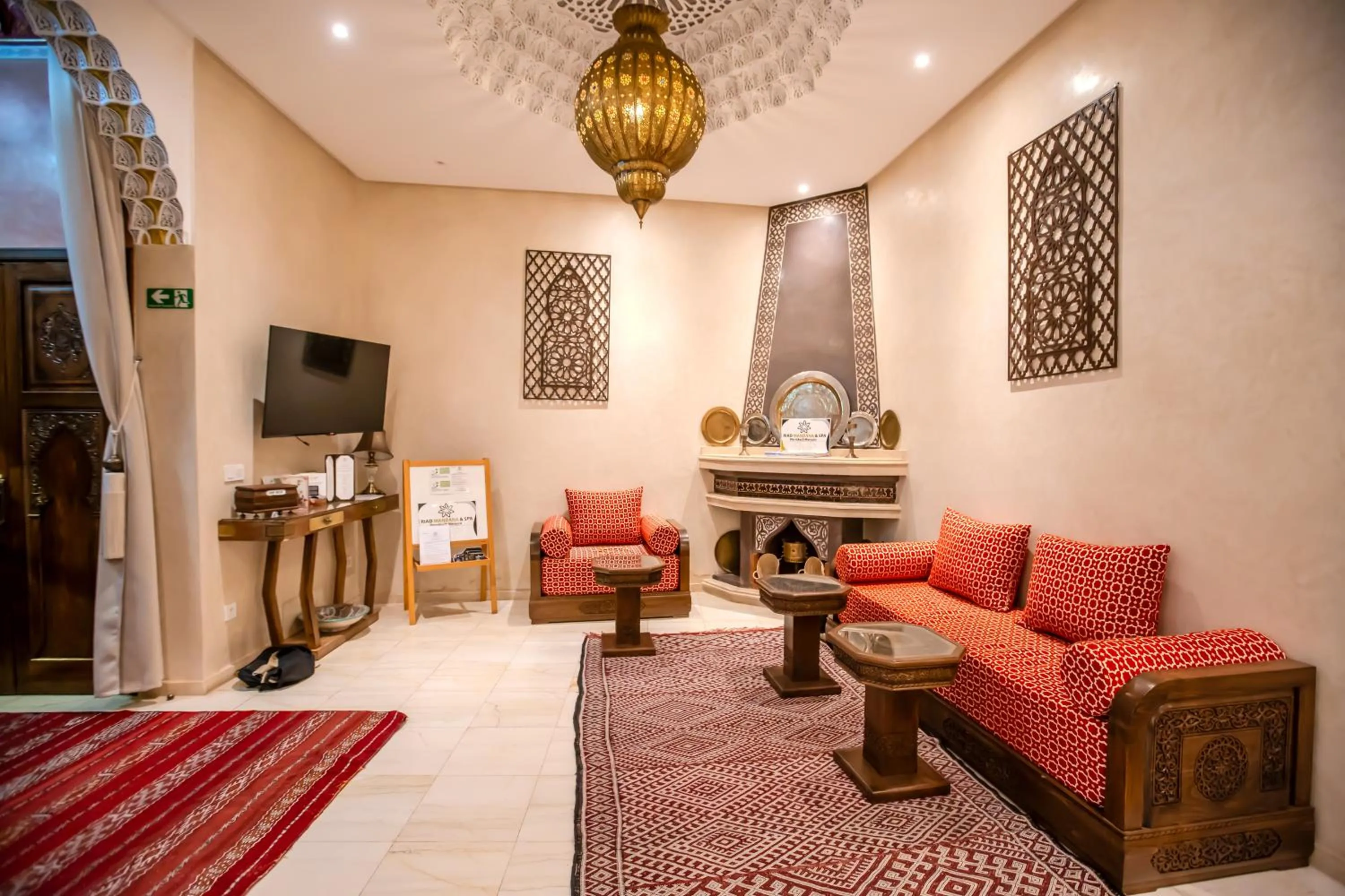 Communal lounge/ TV room in Riad Mandana & Spa