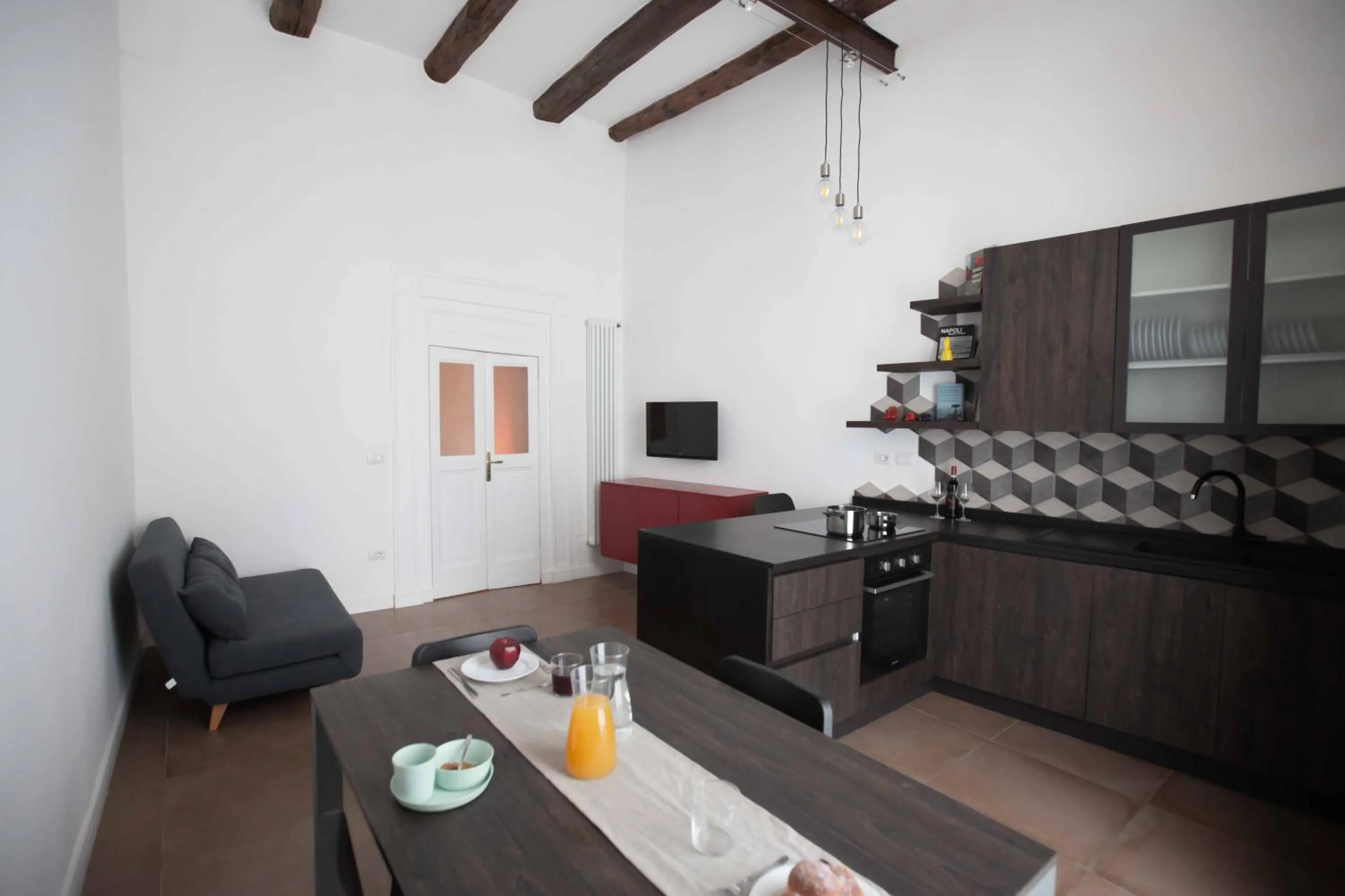 Communal lounge/ TV room in Domus Delia Luxury Apartment