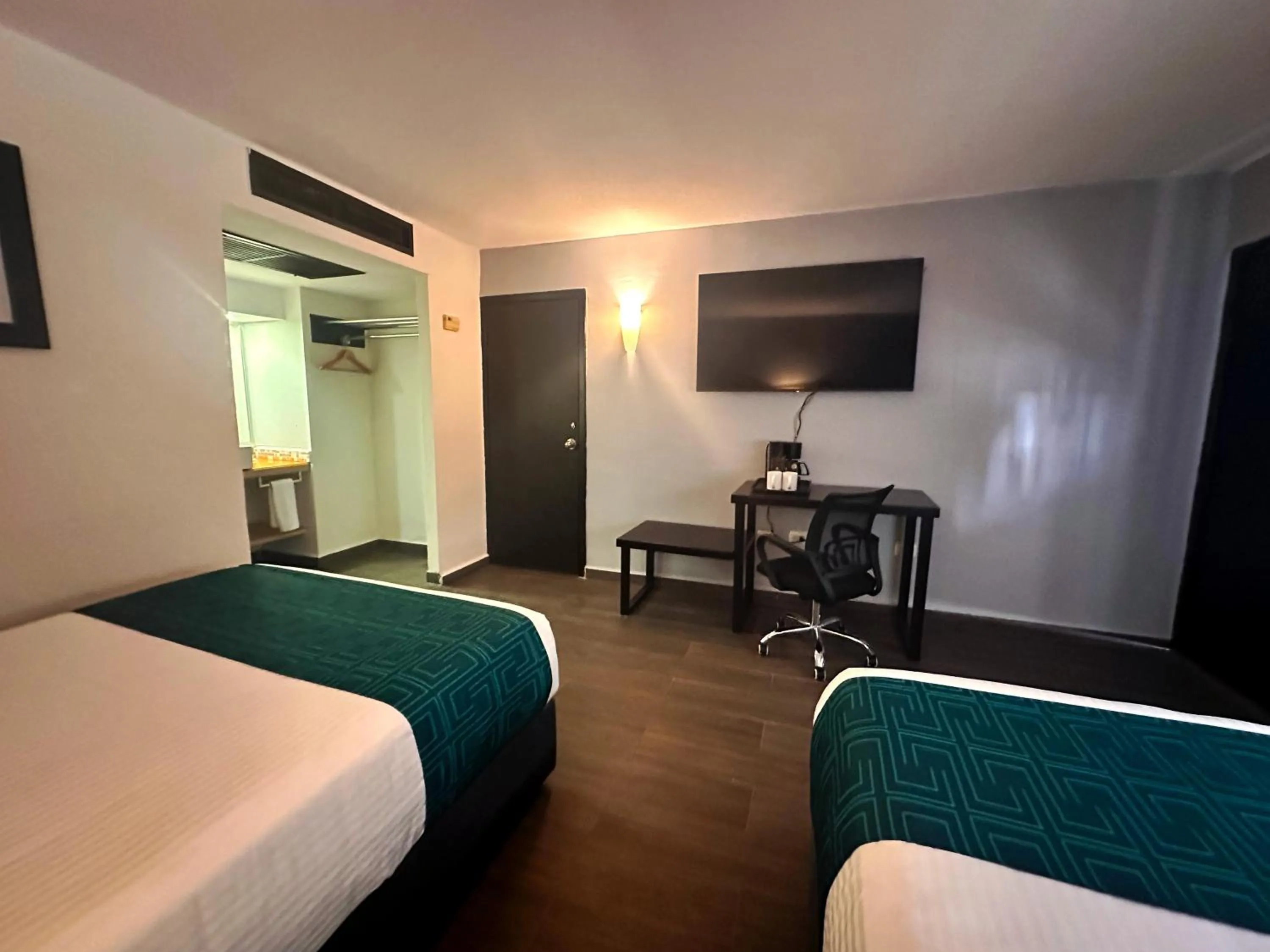 Bed in InHouse Hotel Obregón