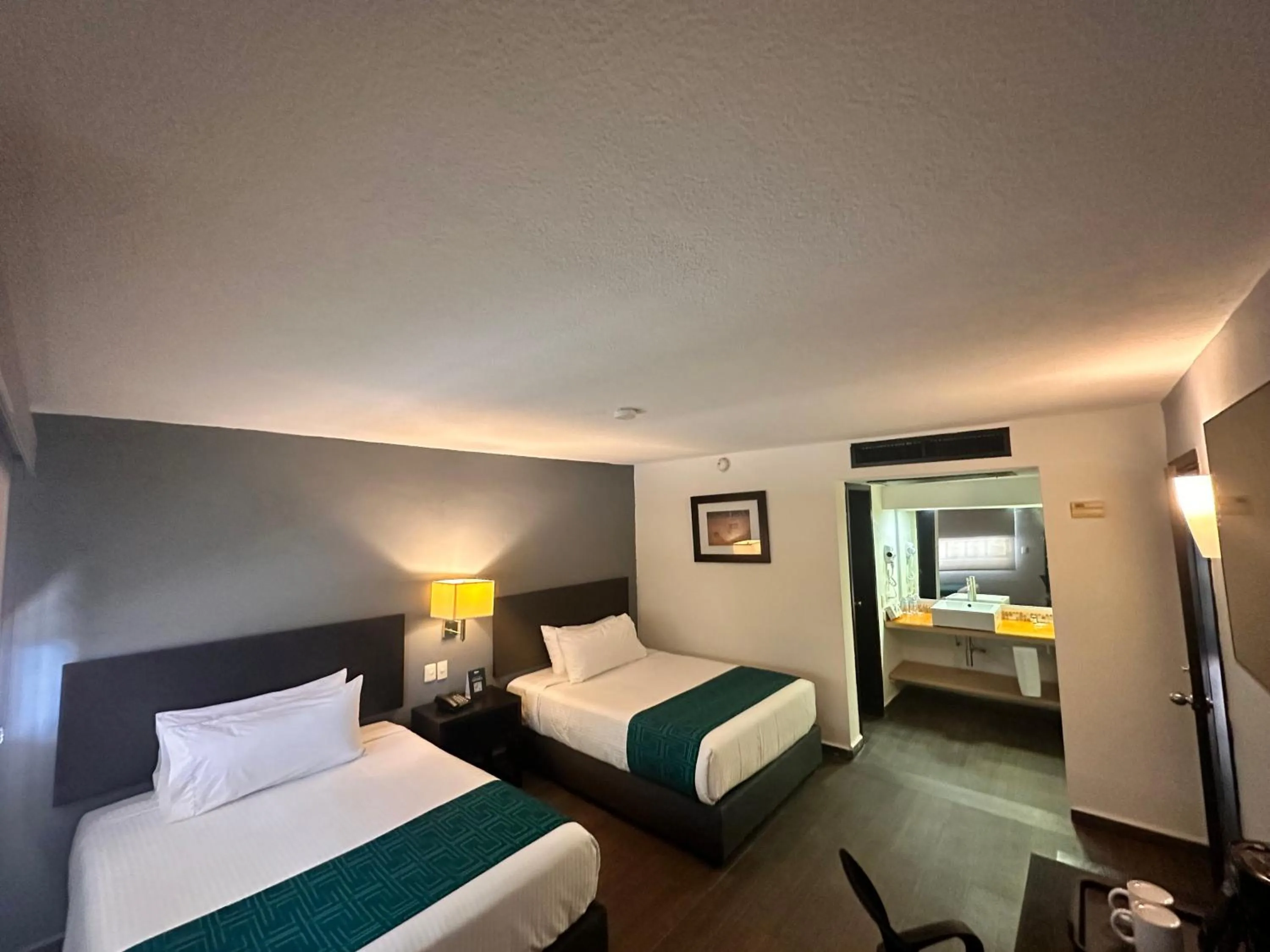 Bed in InHouse Hotel Obregón