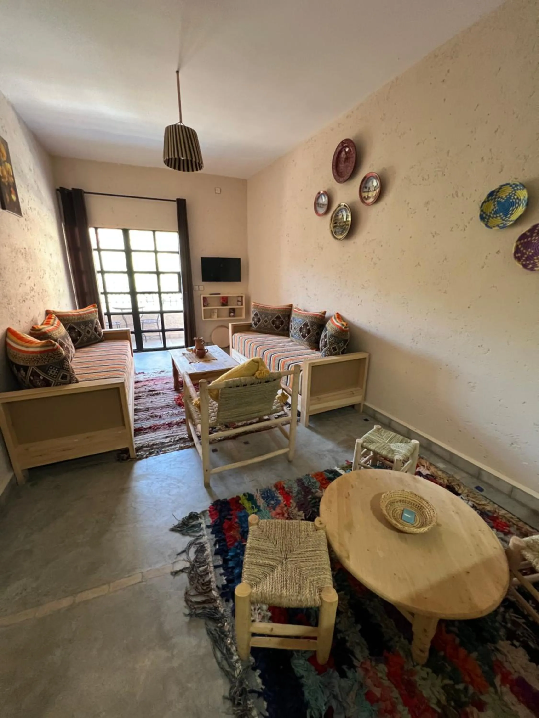 Communal lounge/ TV room in Tazart Lodge