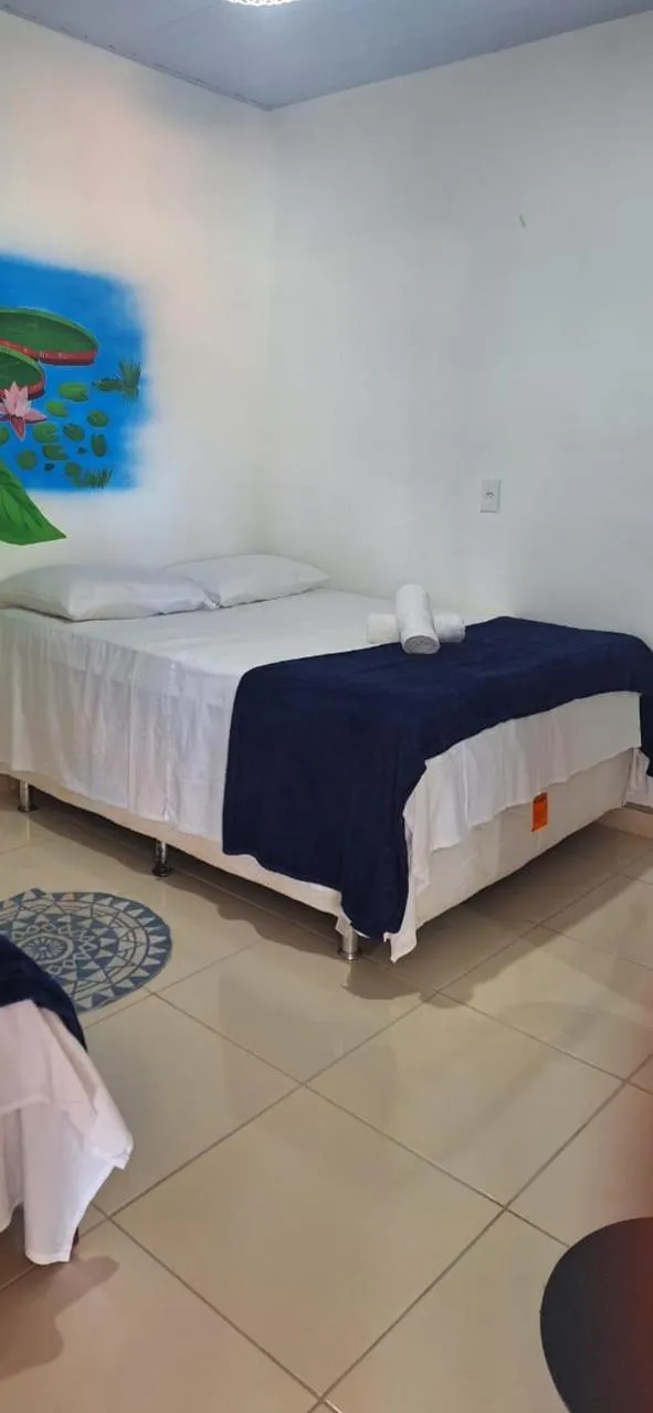 Bed in Pousada Angatu alter