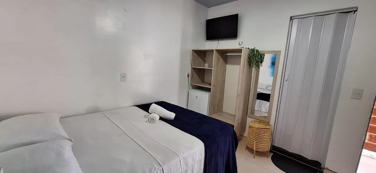 Bed in Pousada Angatu alter