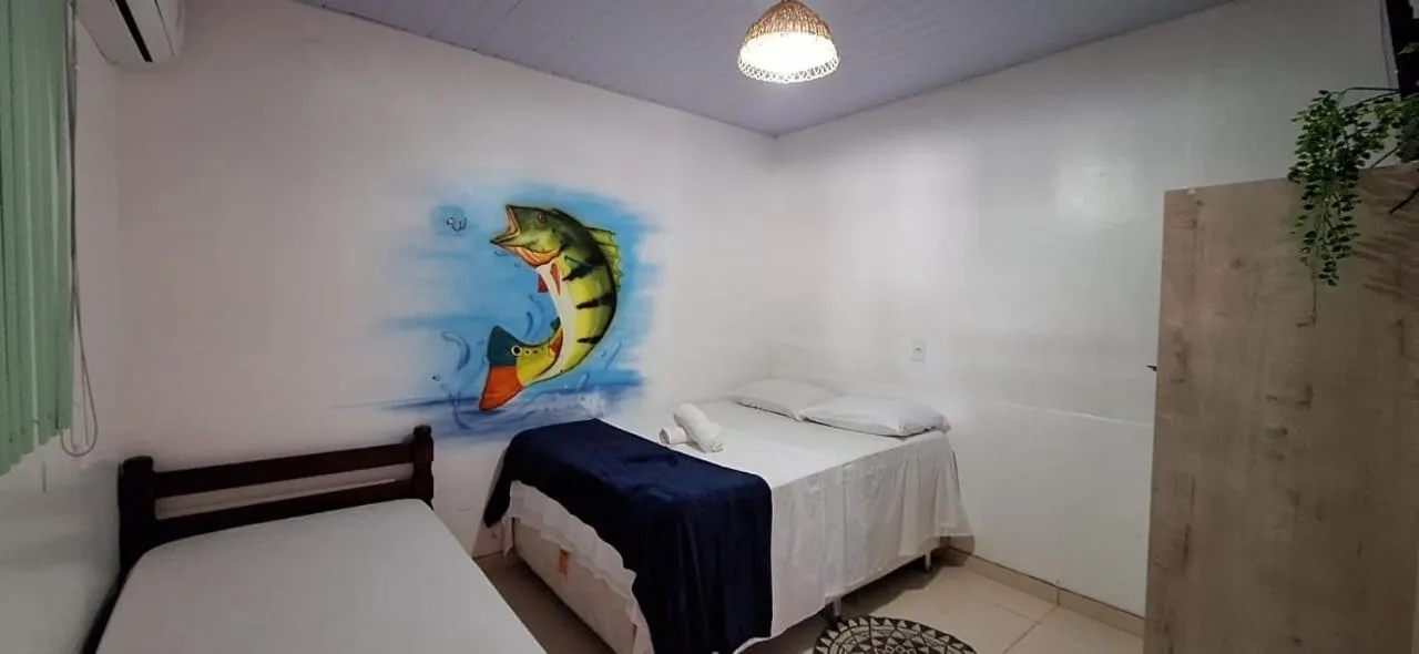 Bed in Pousada Angatu alter