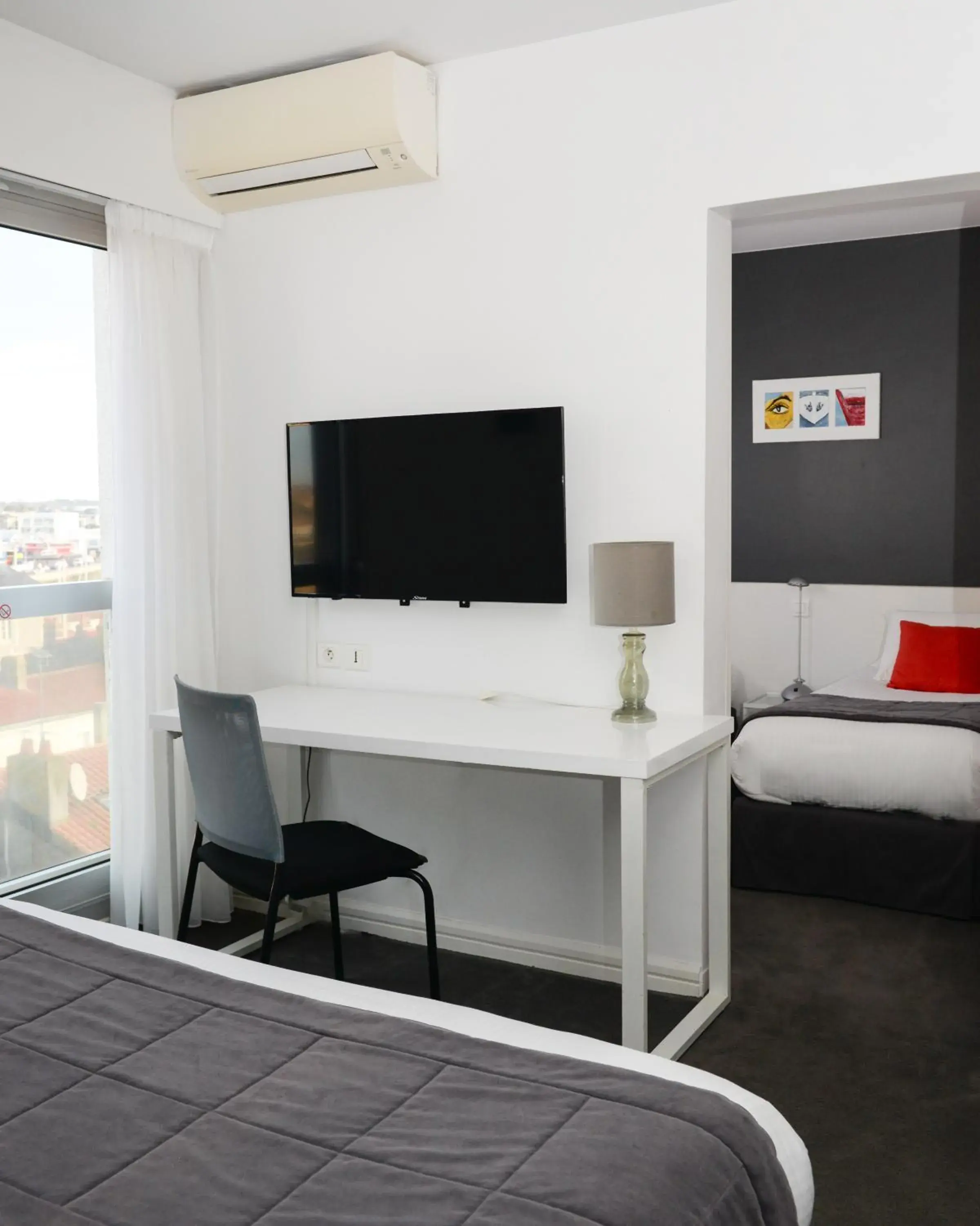 Seating area, Bed in Kyriad Prestige Les Sables d'Olonne - Plage - Centre des Congrès Seating area, Bed in Kyriad Prestige Les Sables d'Olonne - Plage - Centre des Congrès