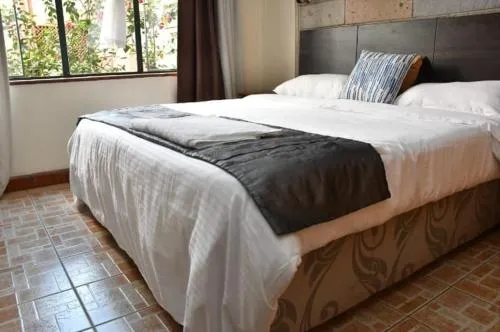Bed in Lux Suites Tropical Towers Apartments Kilimani
