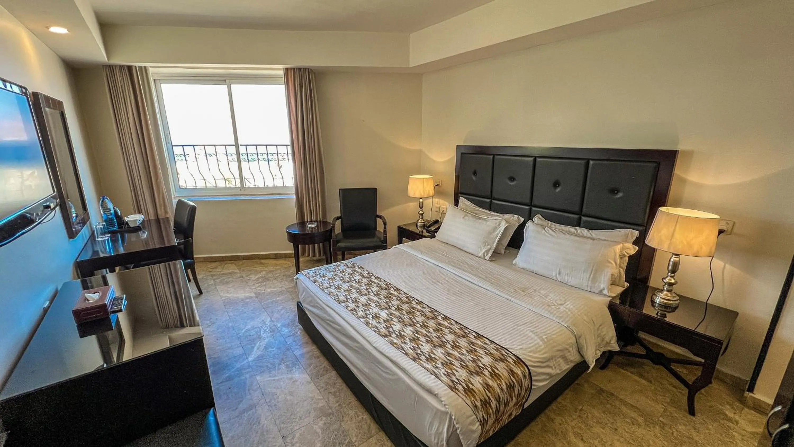 Communal lounge/ TV room, Bed in Yafko Hotel