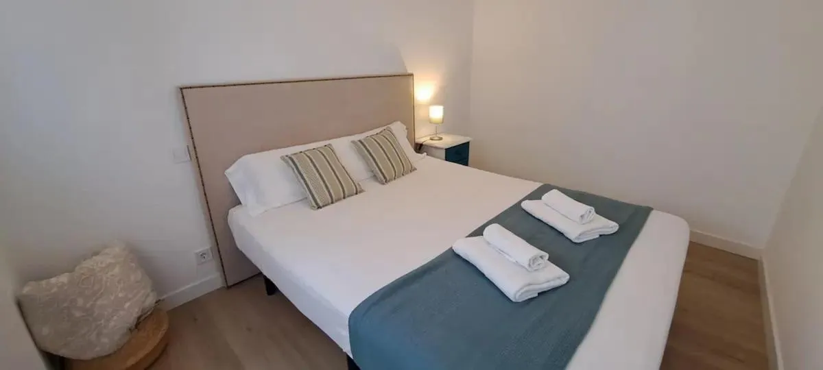 Bed in La Arena Apartamentos Zierbena