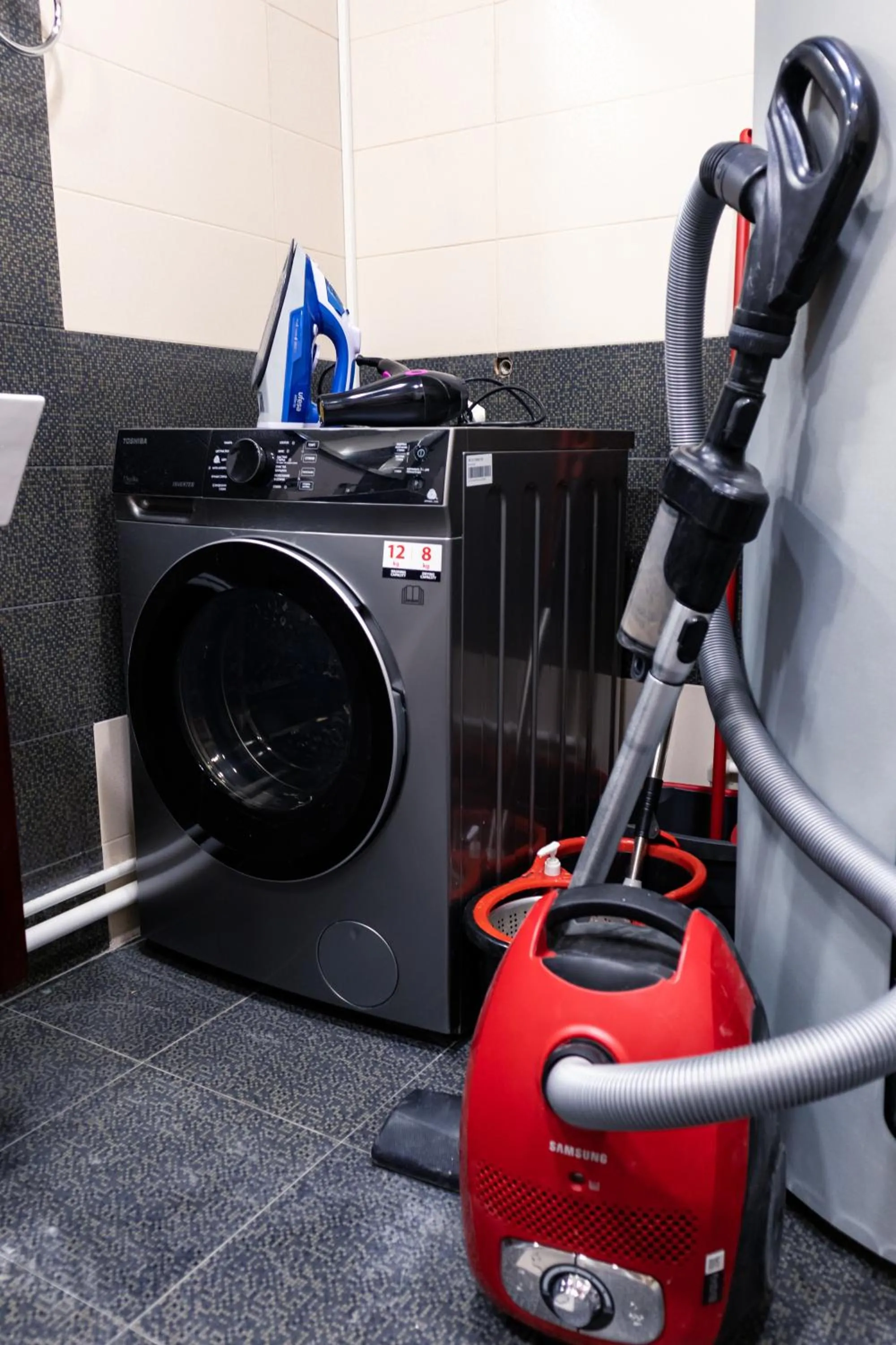 washing machine in hotelise I Escape Apartment