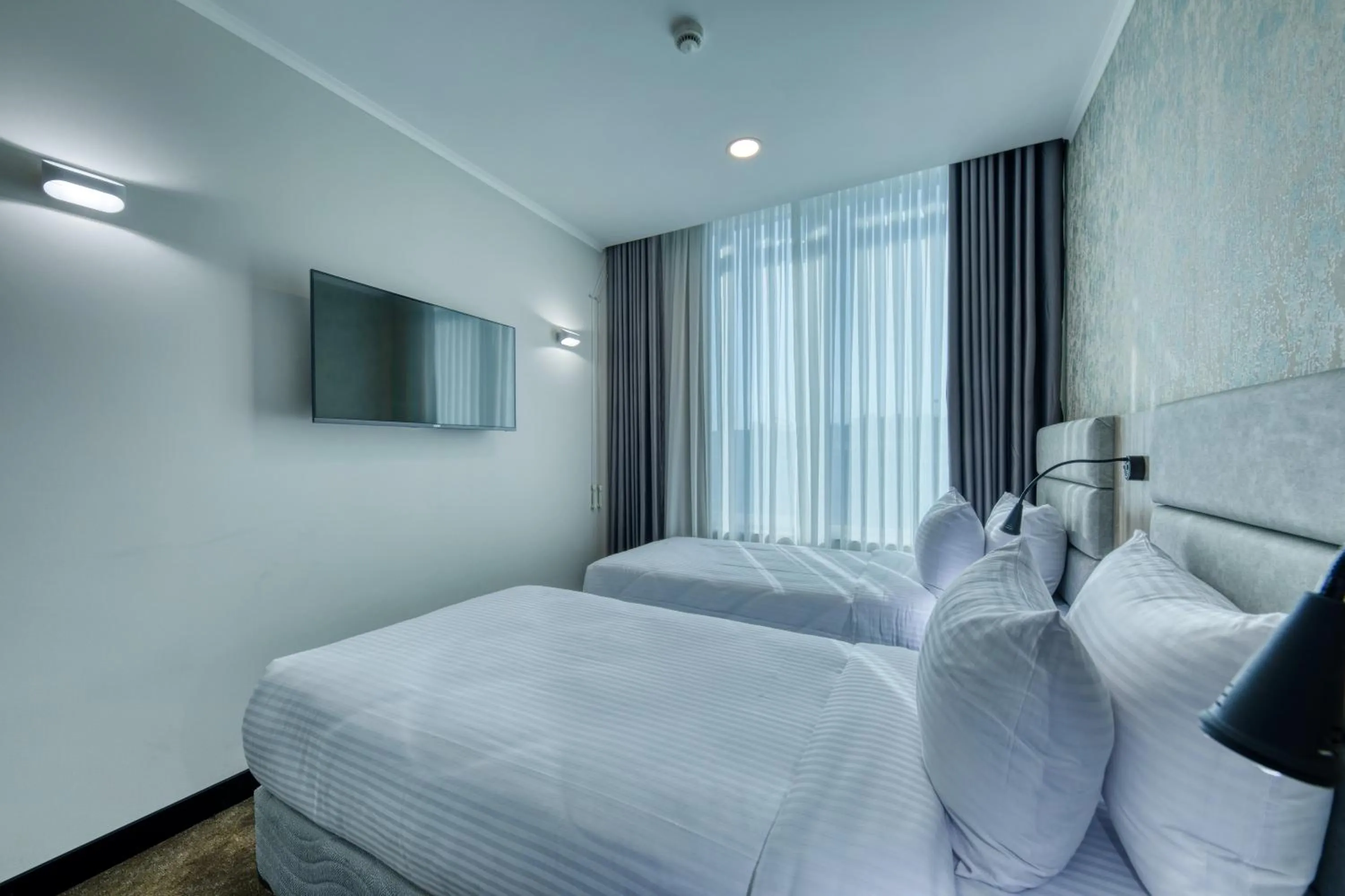 Bed in Expocore Hotel