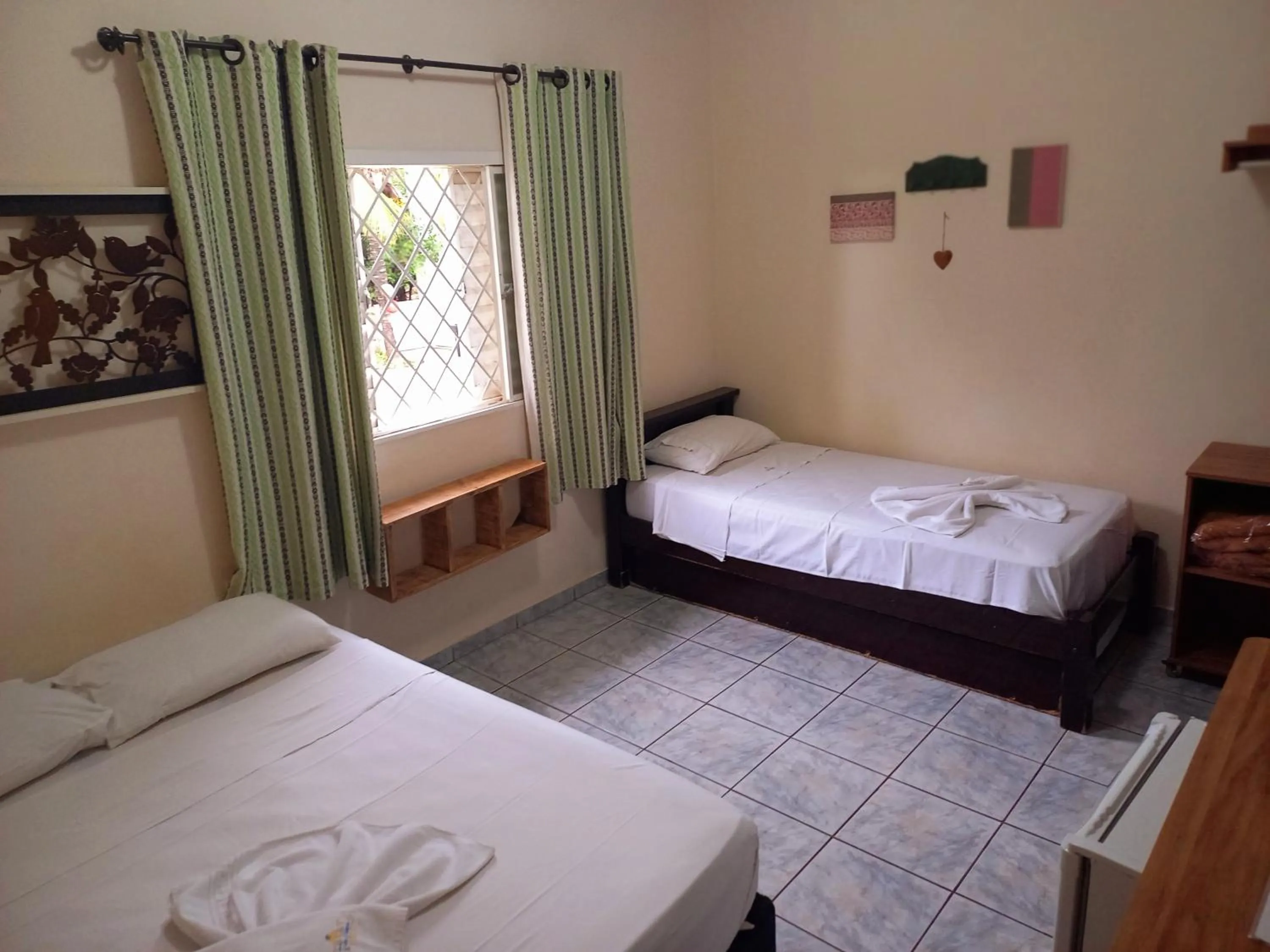 Photo of the whole room, Bed in Pousada Tia Nena