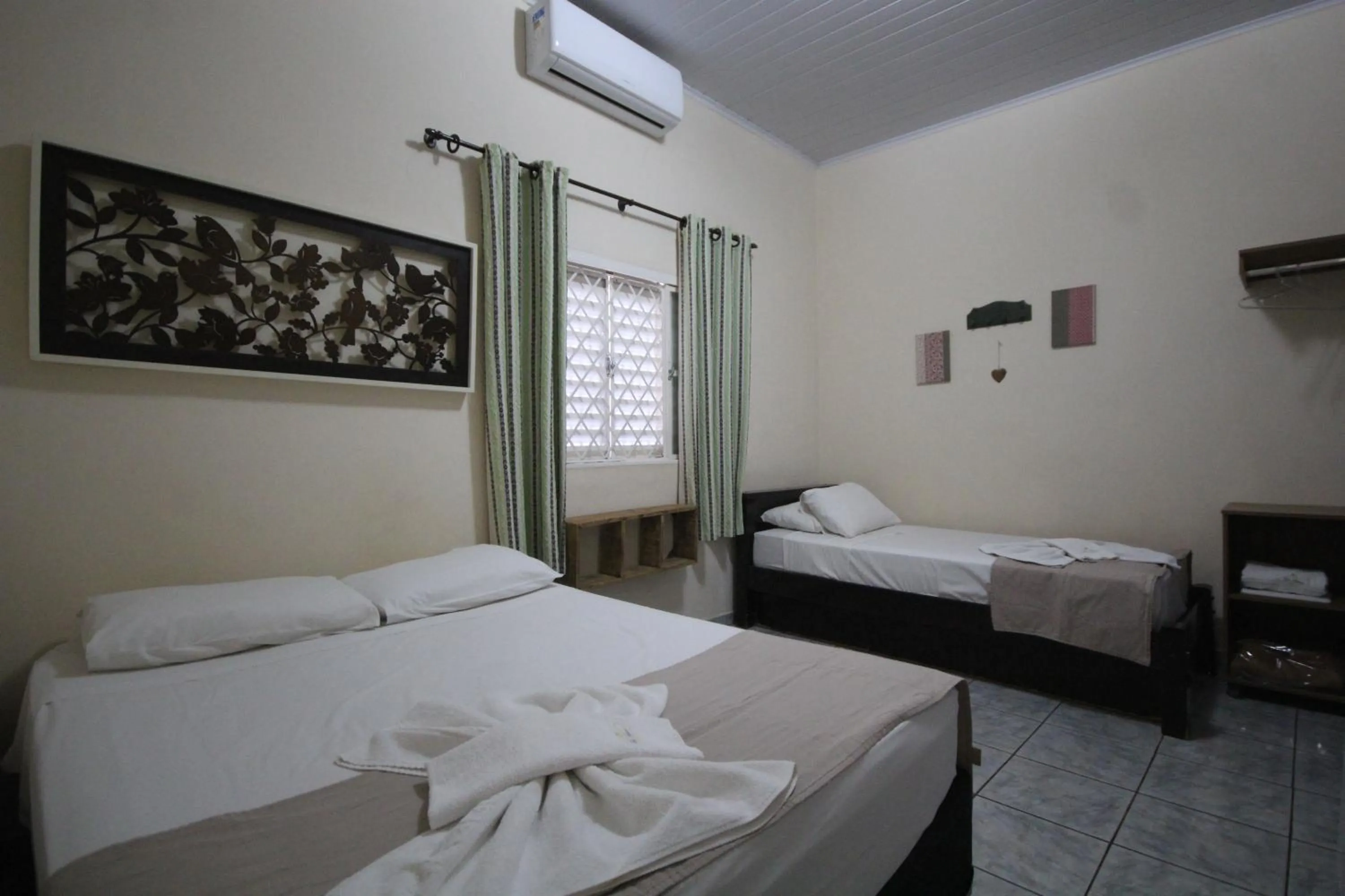 Photo of the whole room, Bed in Pousada Tia Nena