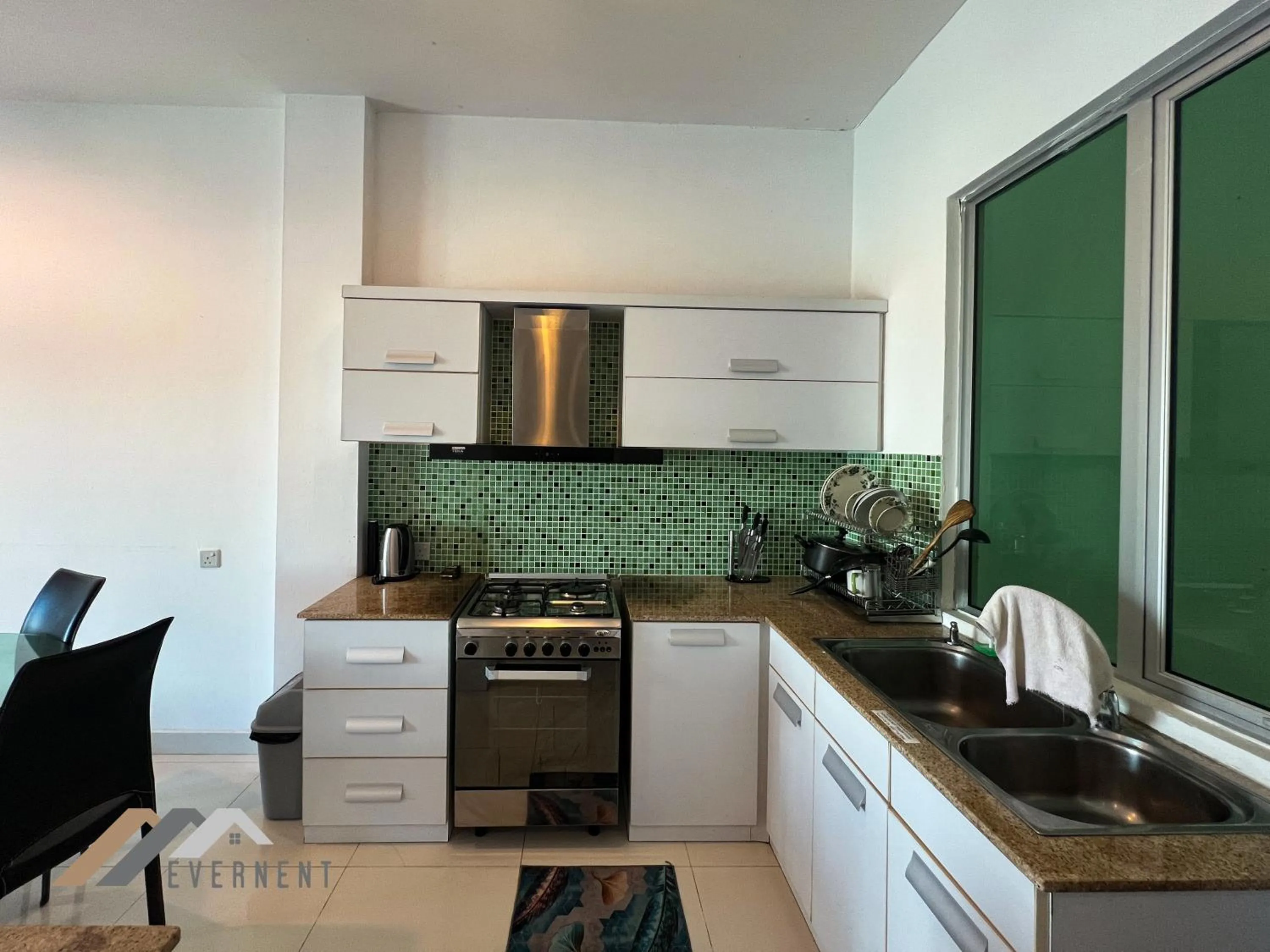 Kitchen or kitchenette in Mciti Suites by Evernent