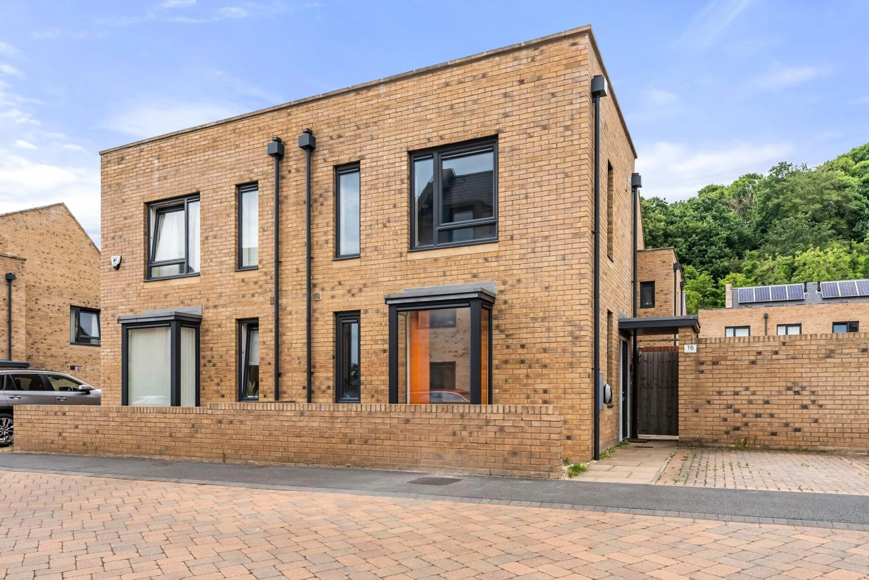 Property building in Sleek and Stylish 2 Bed with Garden and Parking