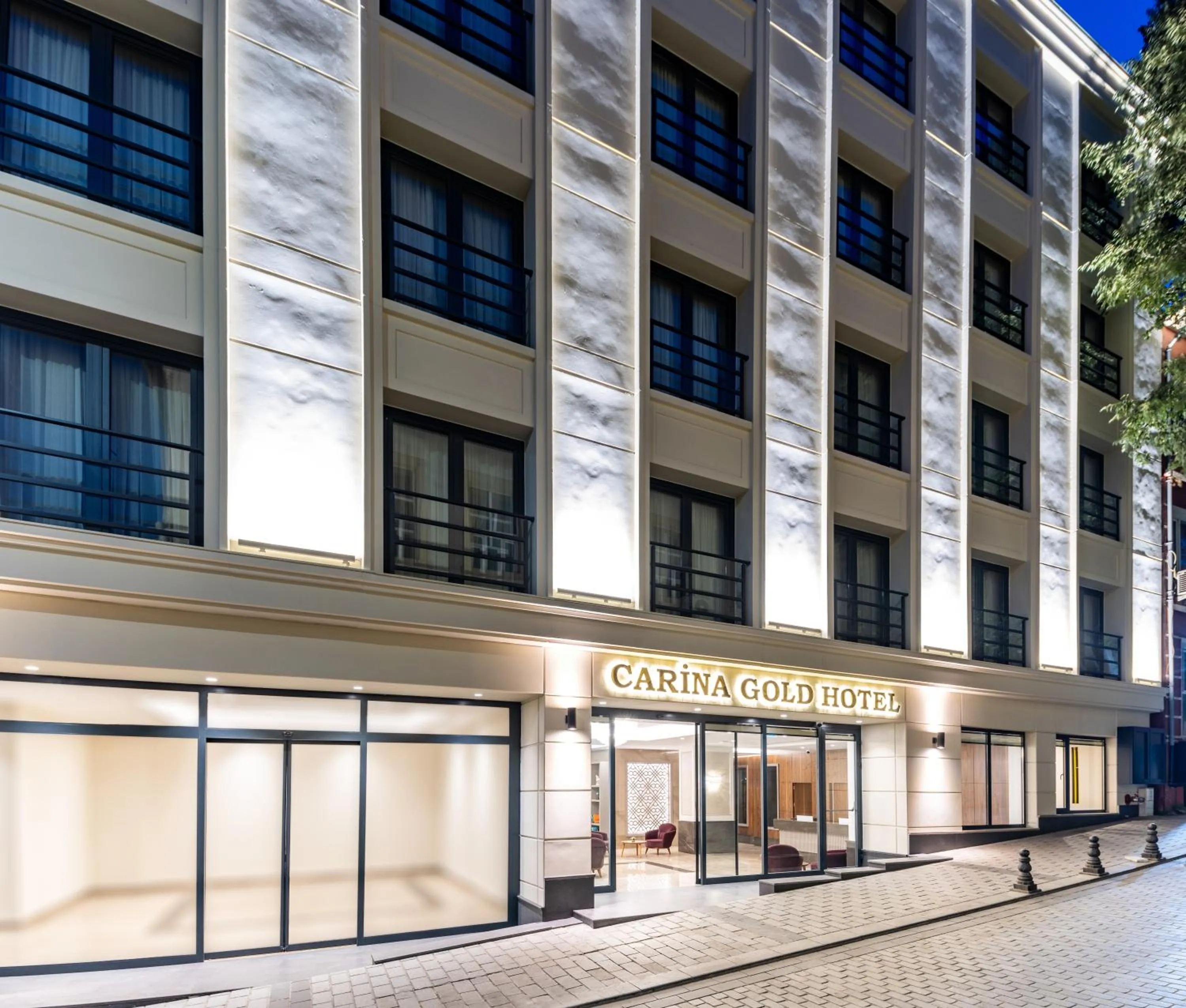 Property building in Carina Gold Hotel And Restaurant