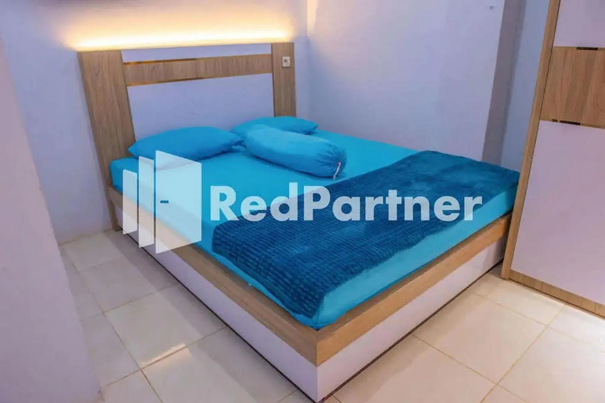 Bed in Hotel Rai's Palopo Exclusive Mitra RedDoorz