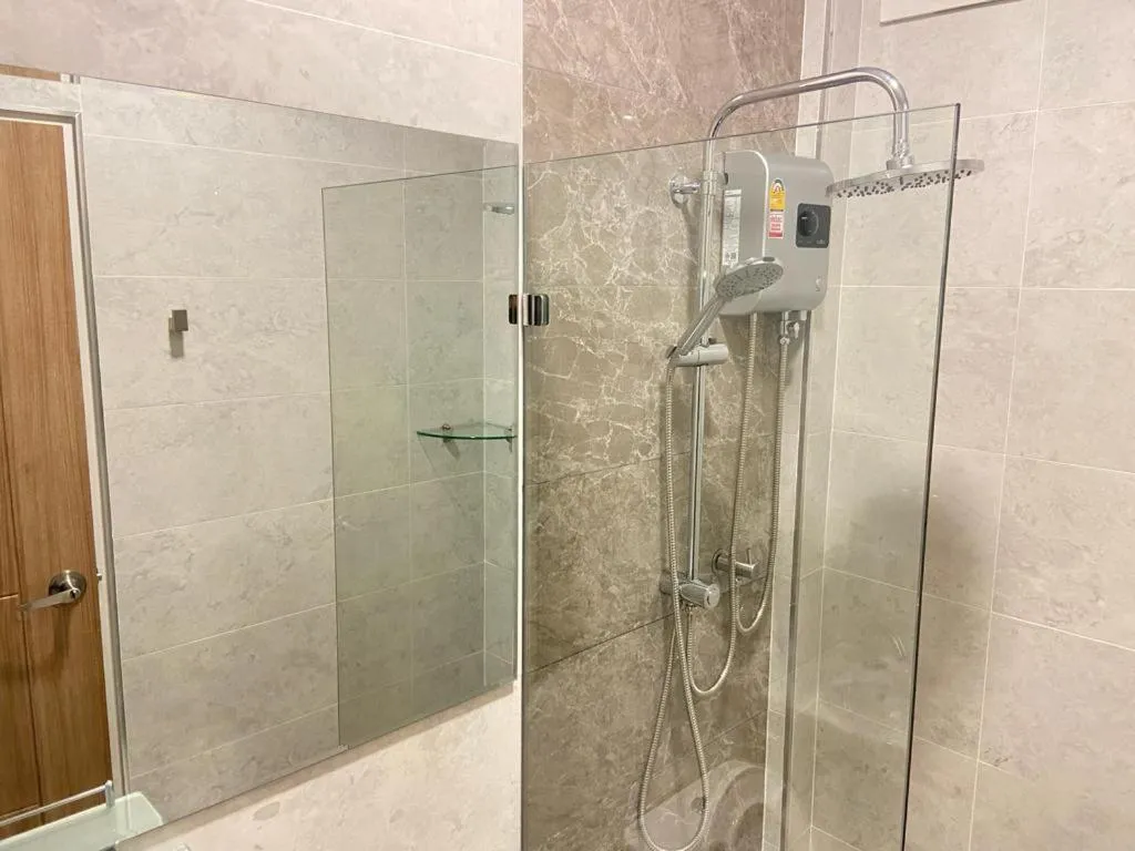 Shower in S.P.C Apartment by Brodderud