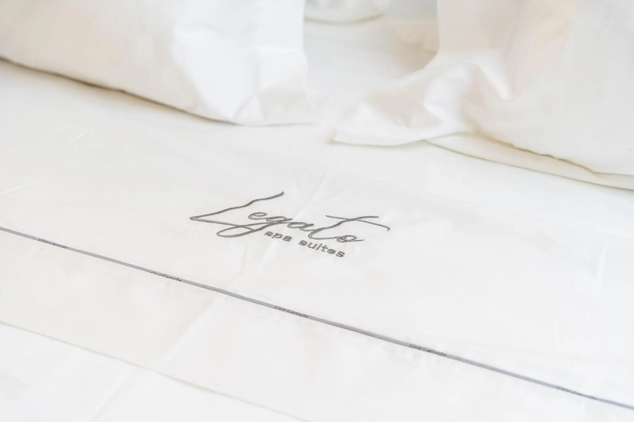 Bed in Legato Spa Suites