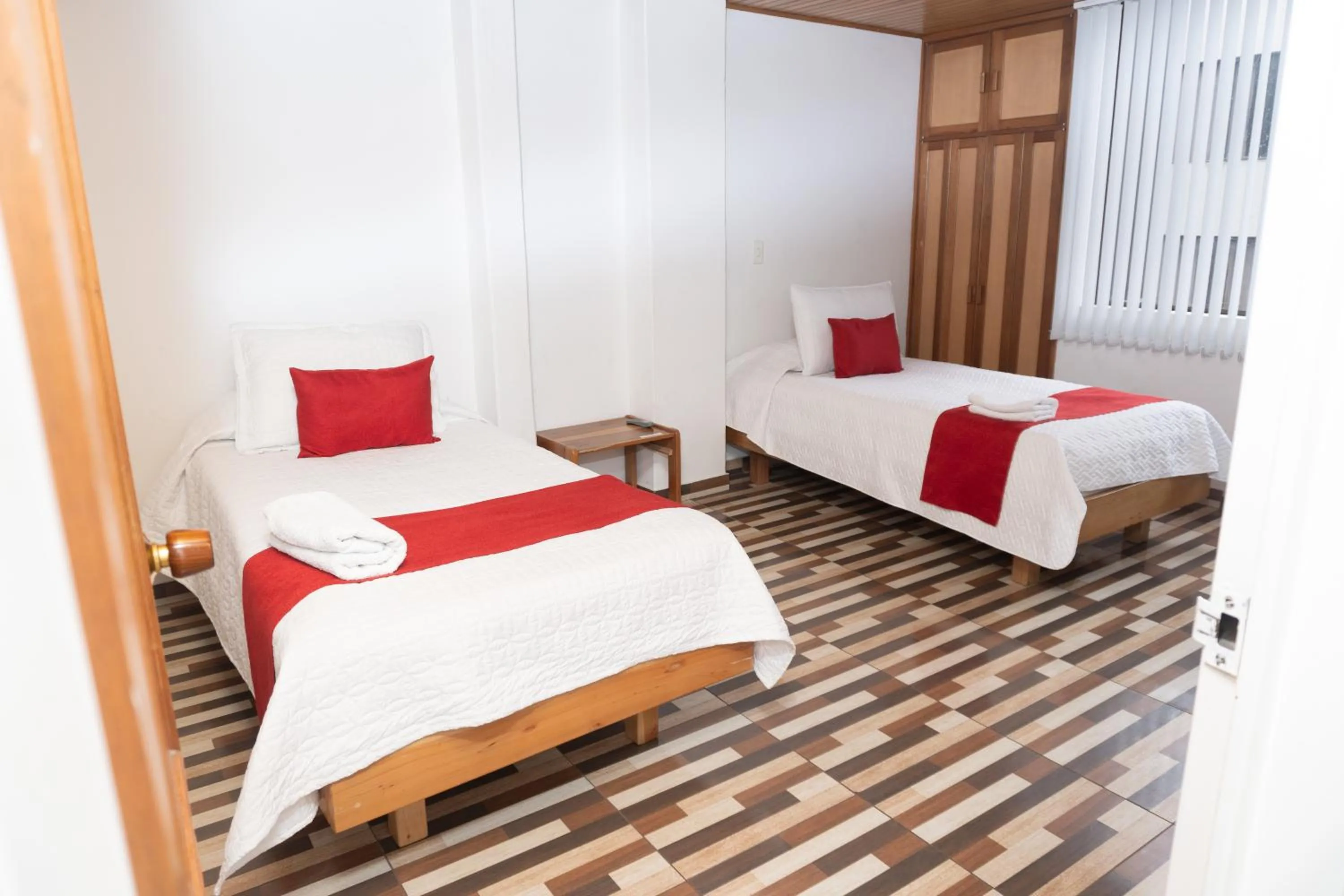 Bed in HOTEL SUAREL CENTER
