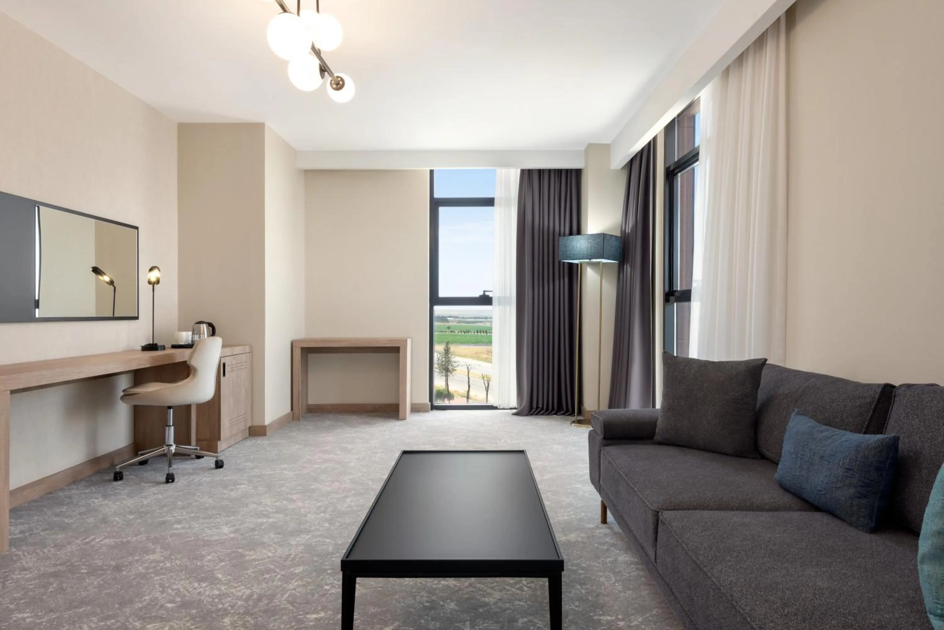 Living room in Ramada Plaza By Wyndham Batman