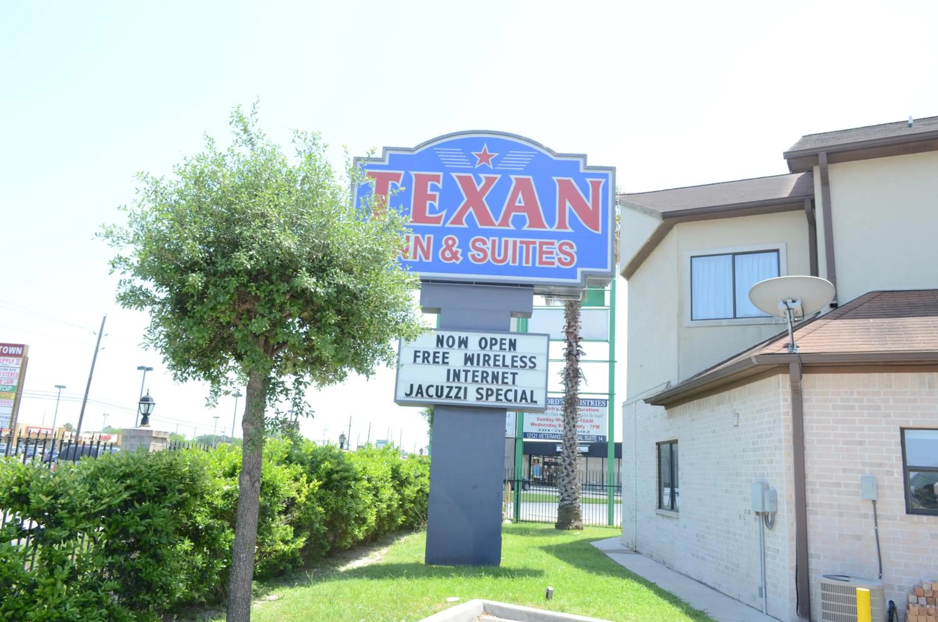 Property logo or sign in Texan Inn & Suites