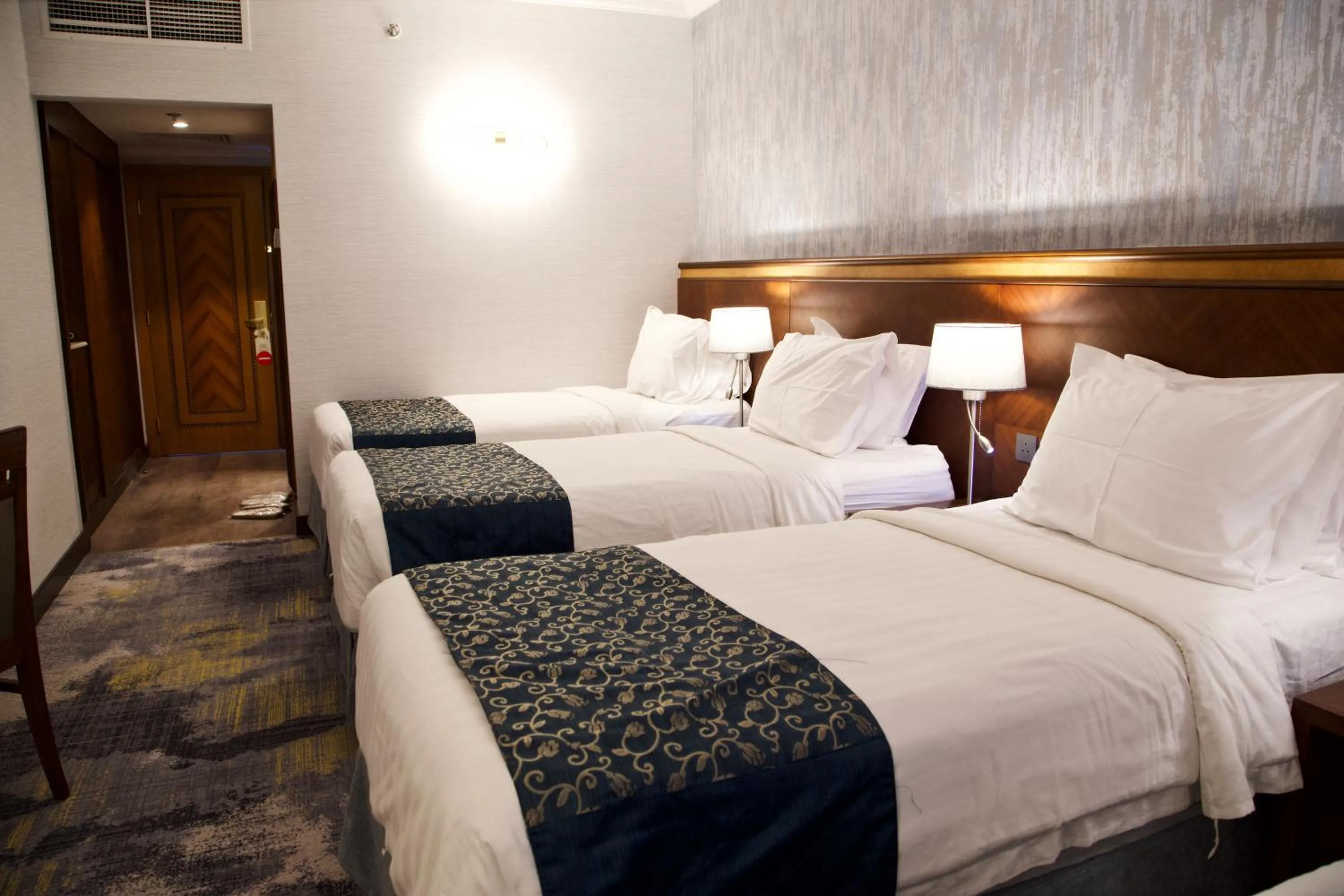 Bed in فندق نزل رويال Nozol Royal Hotel