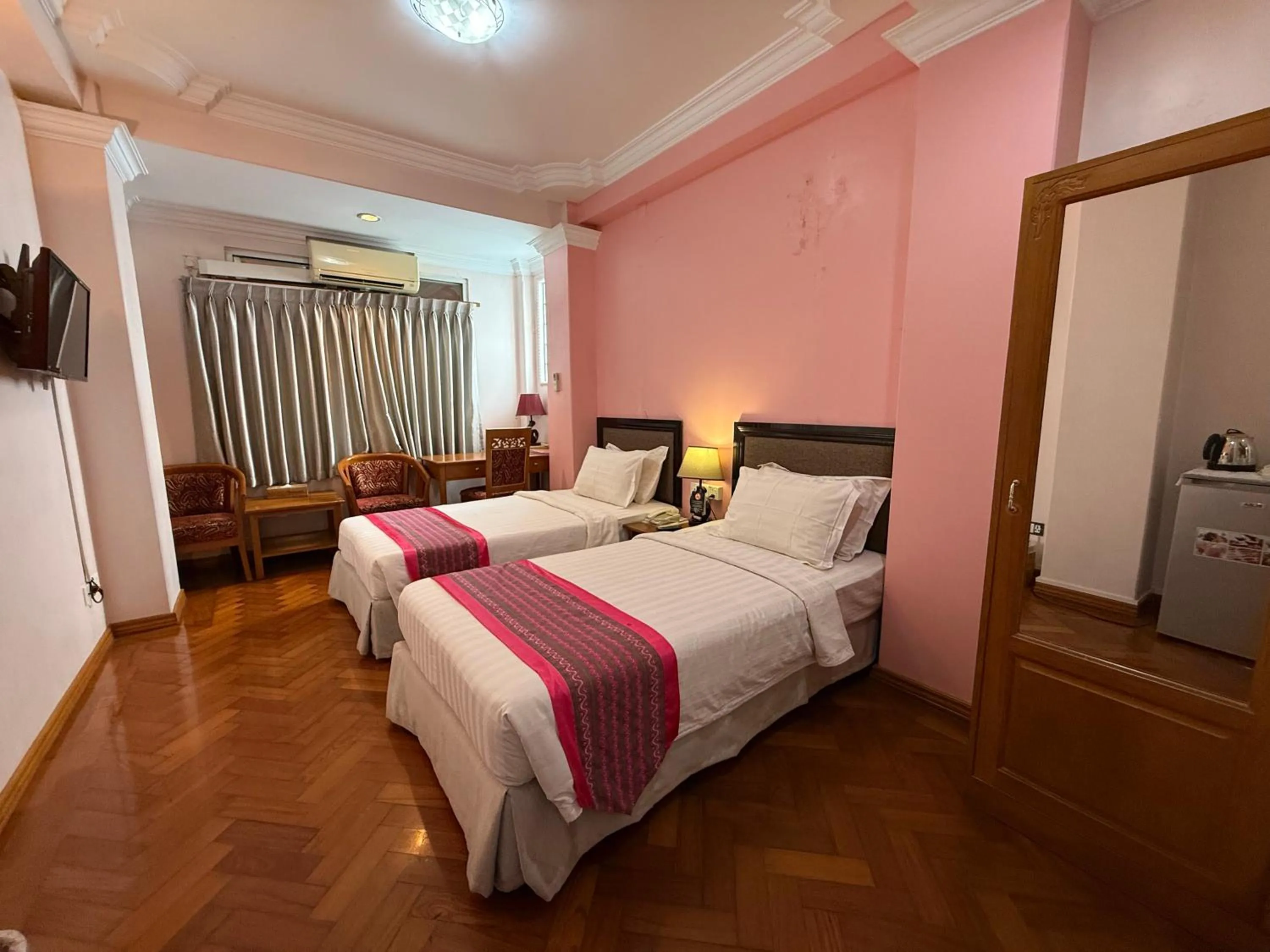 Bed in Grand Laurel Hotel