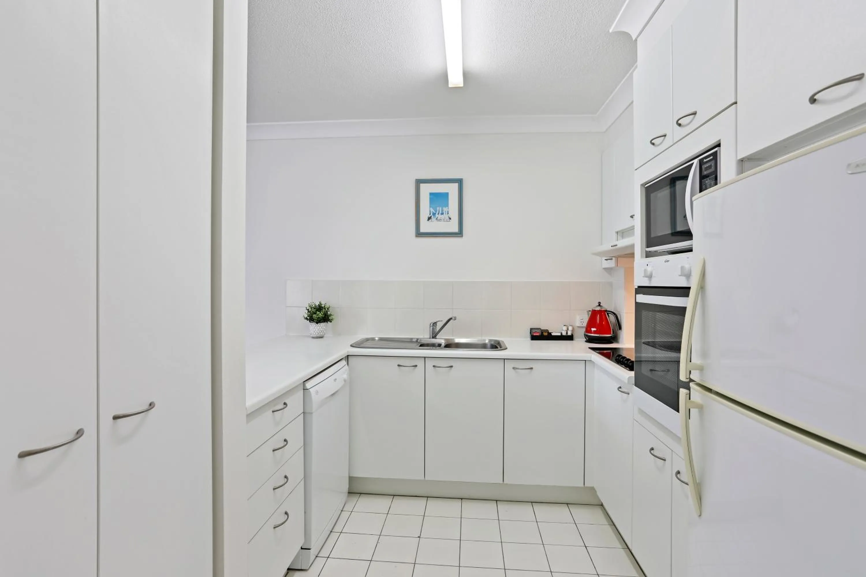 Kitchen or kitchenette in Le Beach Apartments