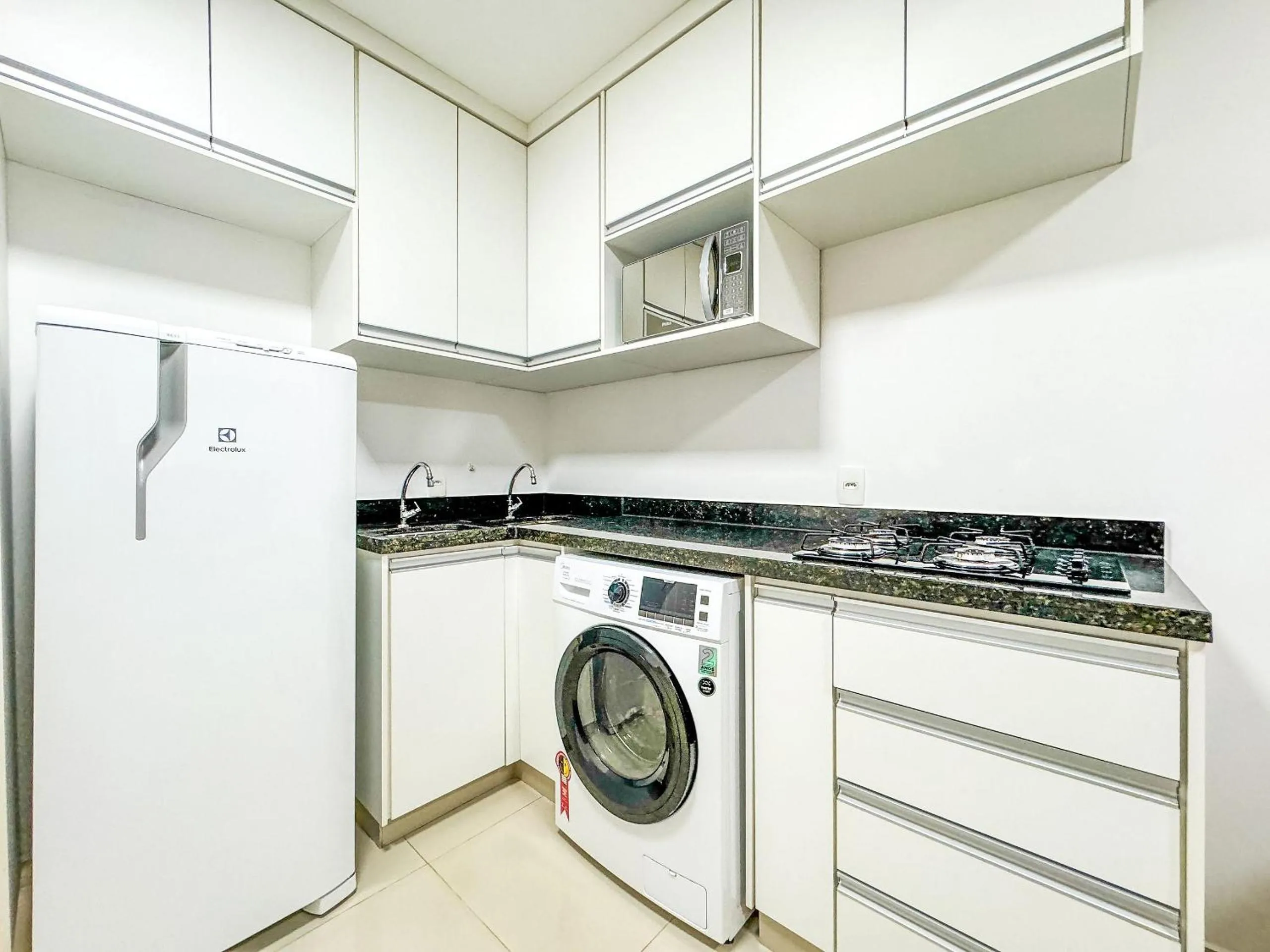 Kitchen or kitchenette in APTOS 1 e 2QTO Lava e Seca e Academia