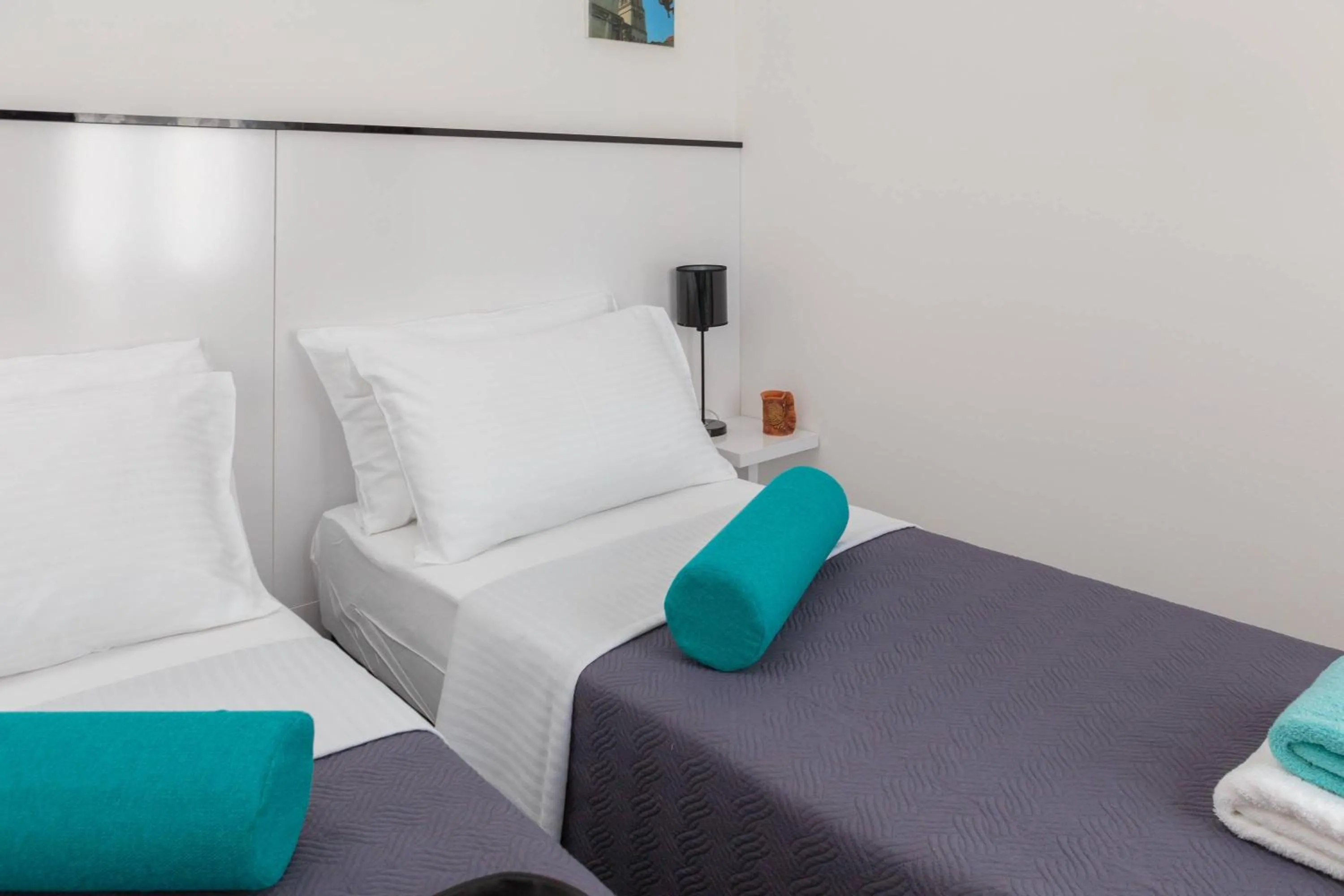 Bed in PLR Luxury Rooms