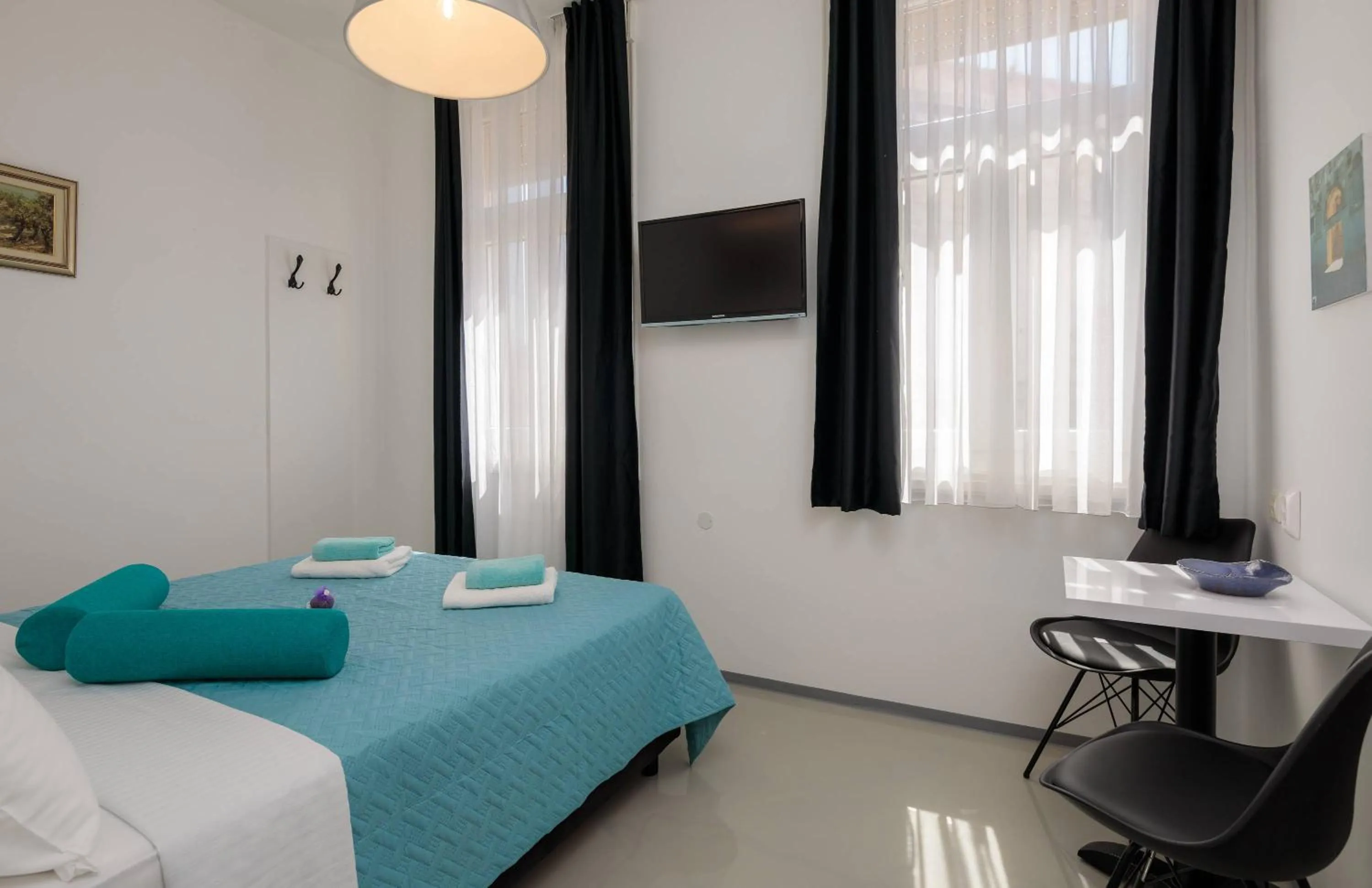 Bed in PLR Luxury Rooms