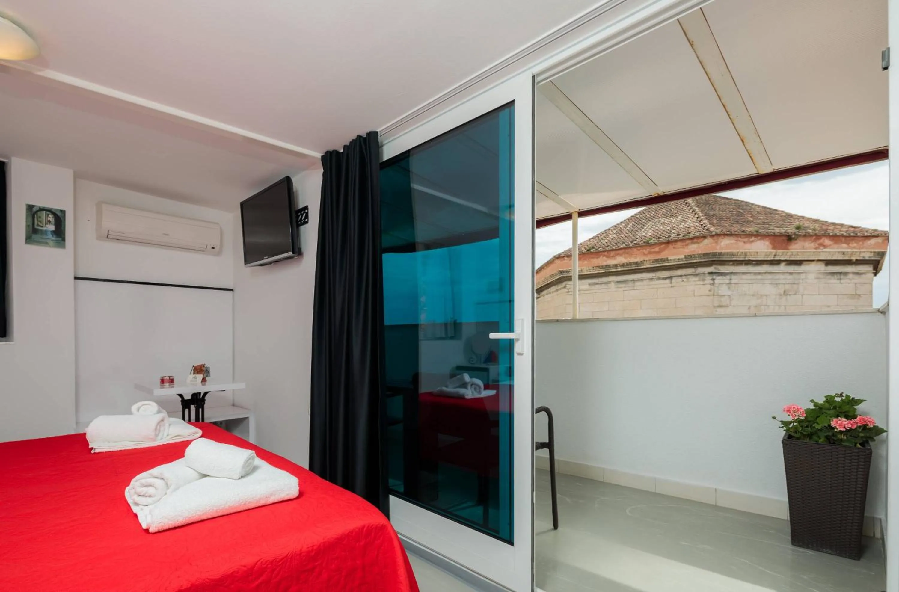 Bed in PLR Luxury Rooms