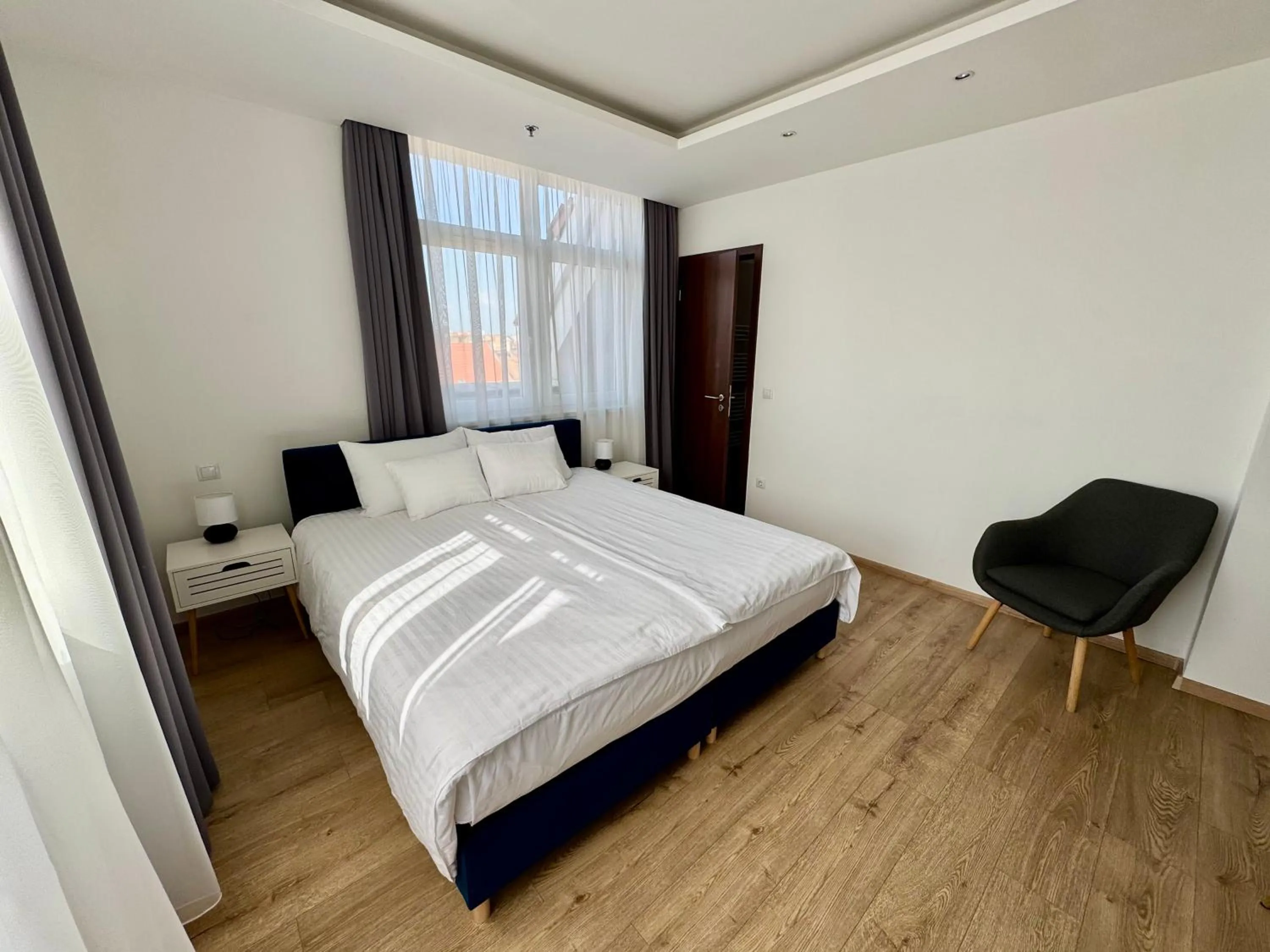 Bed in Rooftop City Residence