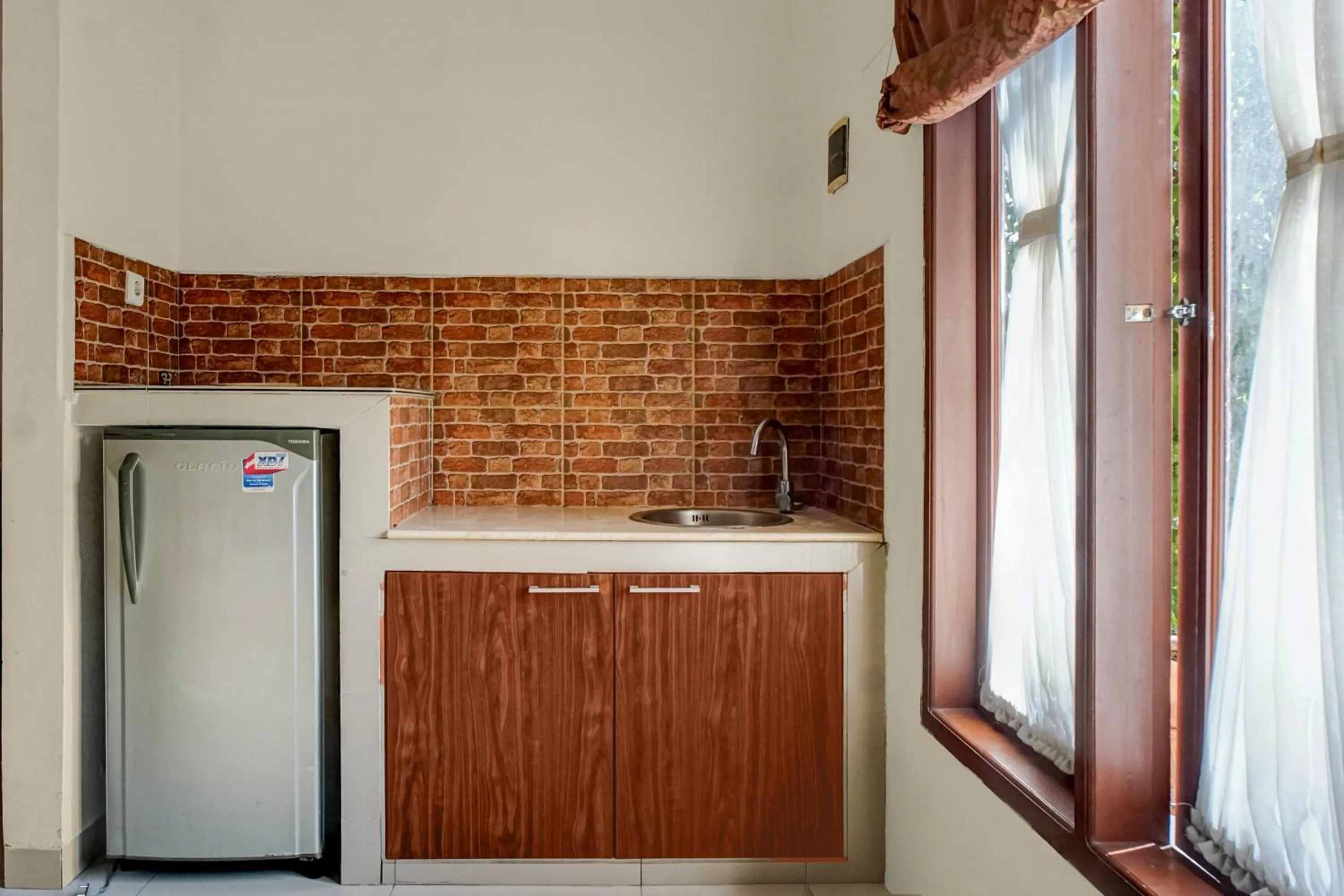 Kitchen or kitchenette in Collection O near University of Sumatera Utara formerly Huber Apartment