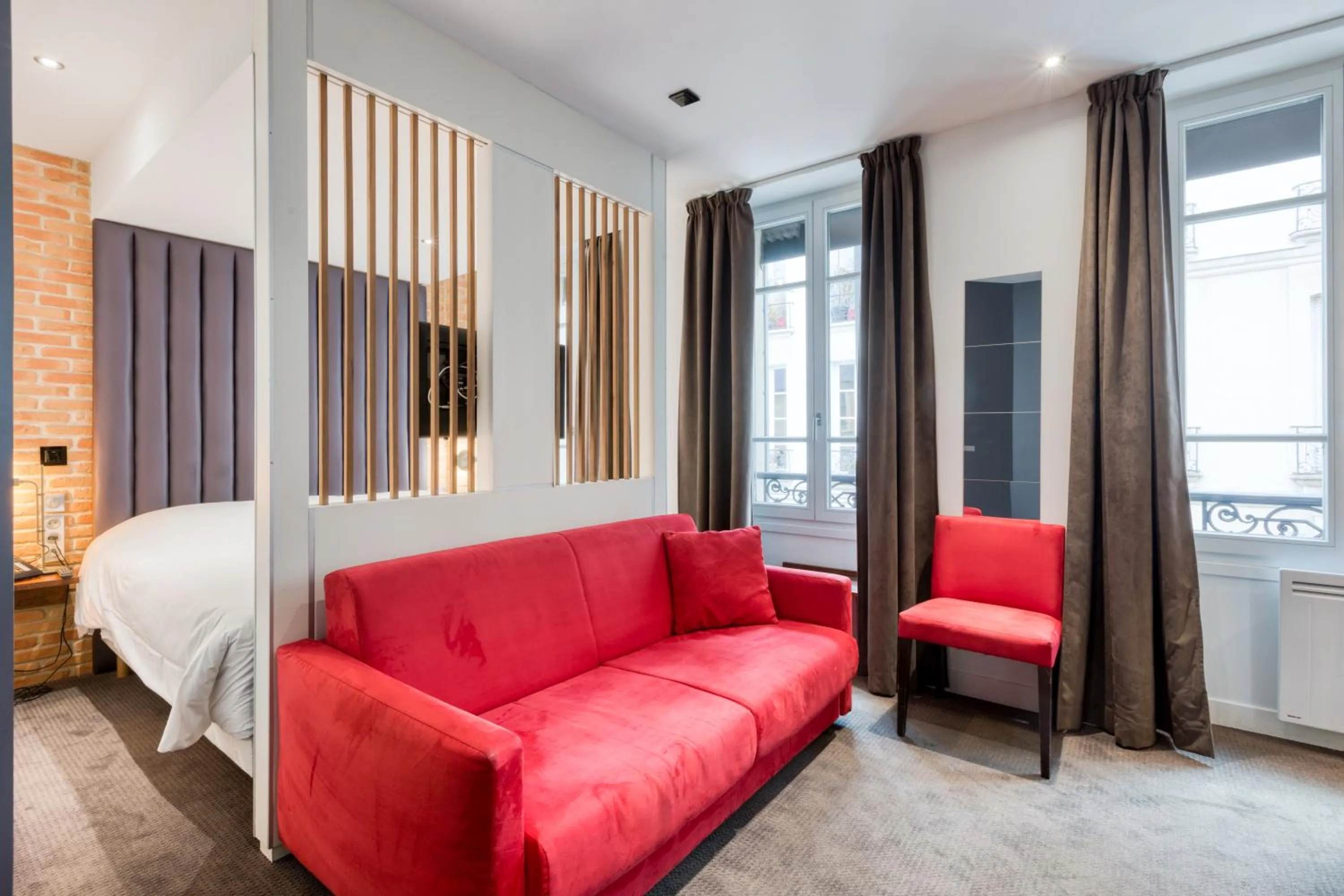 Living room, Bed in Hôtel du Jeu de Paume