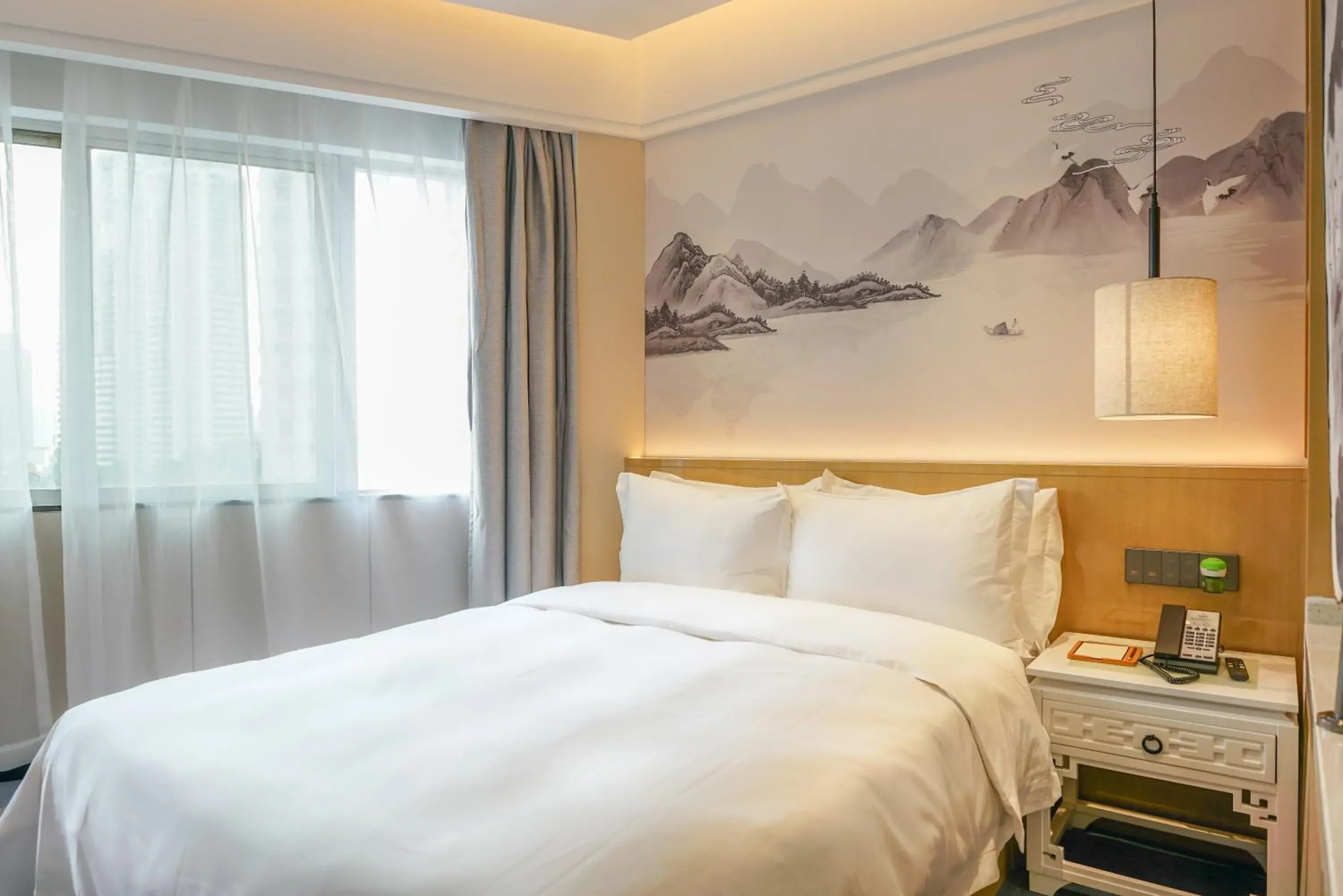 Bed in Paco Hotel Shenzhen Luohu Port Bed in Paco Hotel Shenzhen Luohu Port