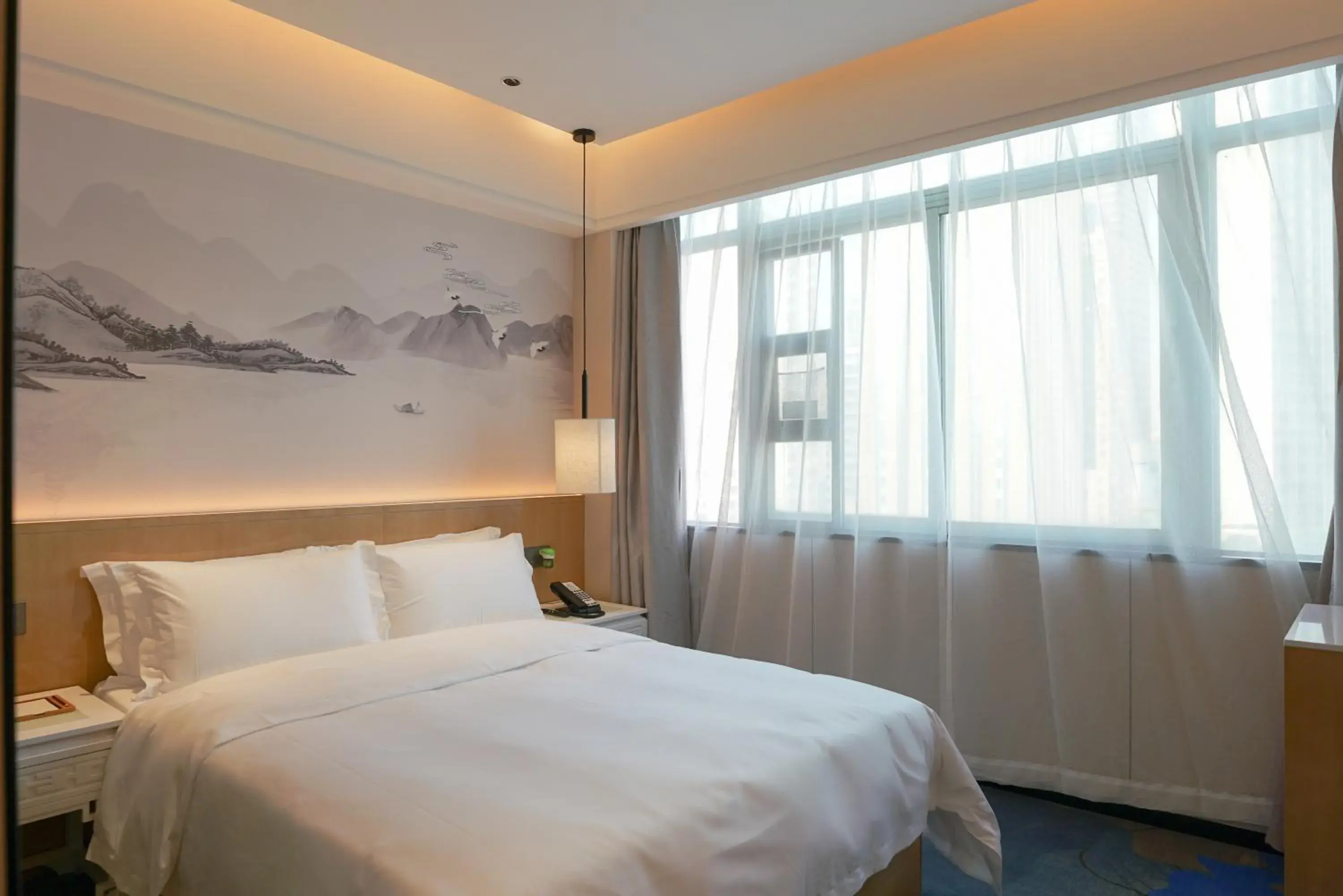 Bed in Paco Hotel Shenzhen Luohu Port Bed in Paco Hotel Shenzhen Luohu Port