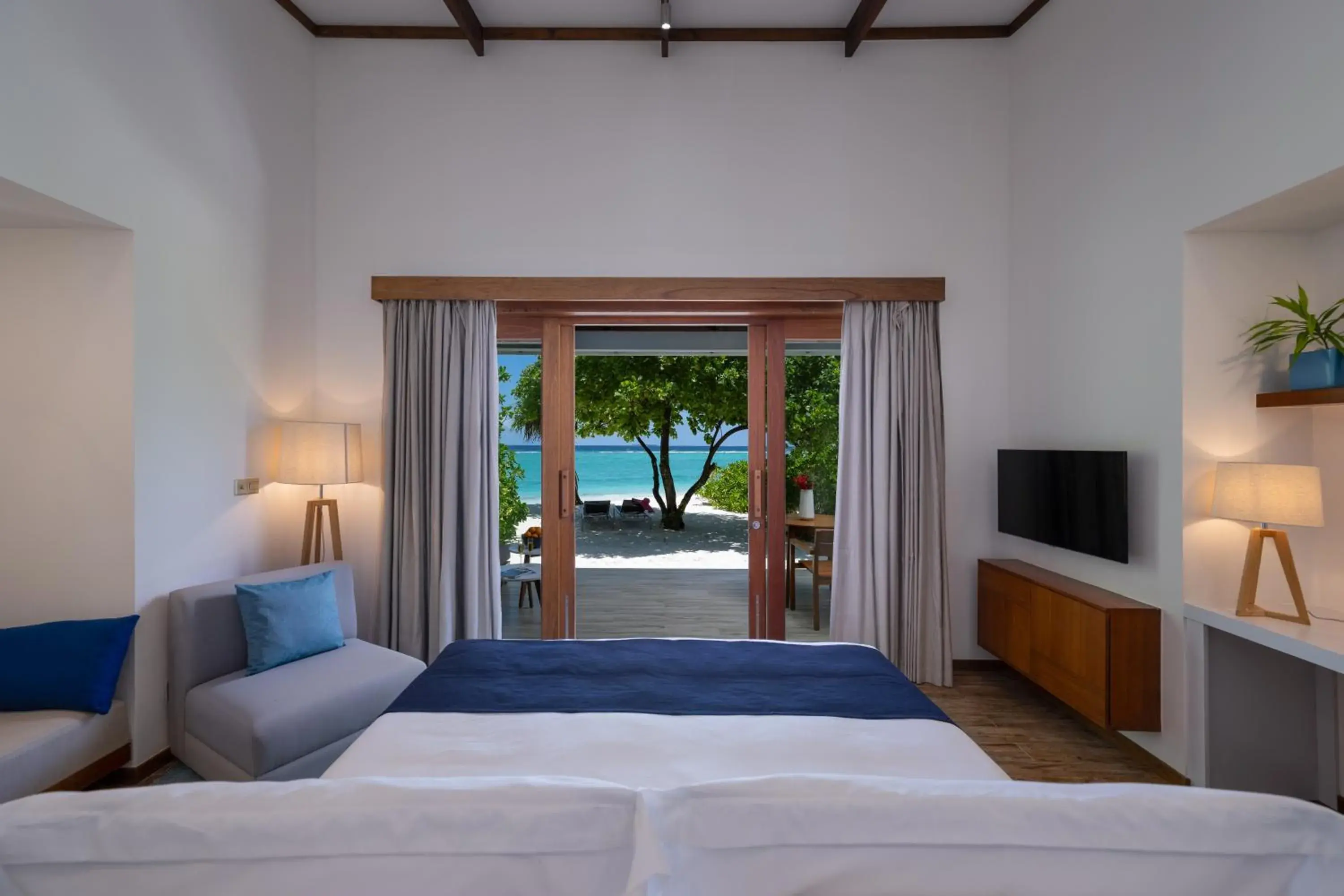 Patio, Bed in Ifuru Island Maldives - Domestic Flight Transport for 2 at Half-Price Valid for Min 5 Night Stays Between 20 Apr to 15 Oct 2026 Patio, Bed in Ifuru Island Maldives - Domestic Flight Transport for 2 at Half-Price Valid for Min 5 Night Stays Between 20 Apr to 15 Oct 2026