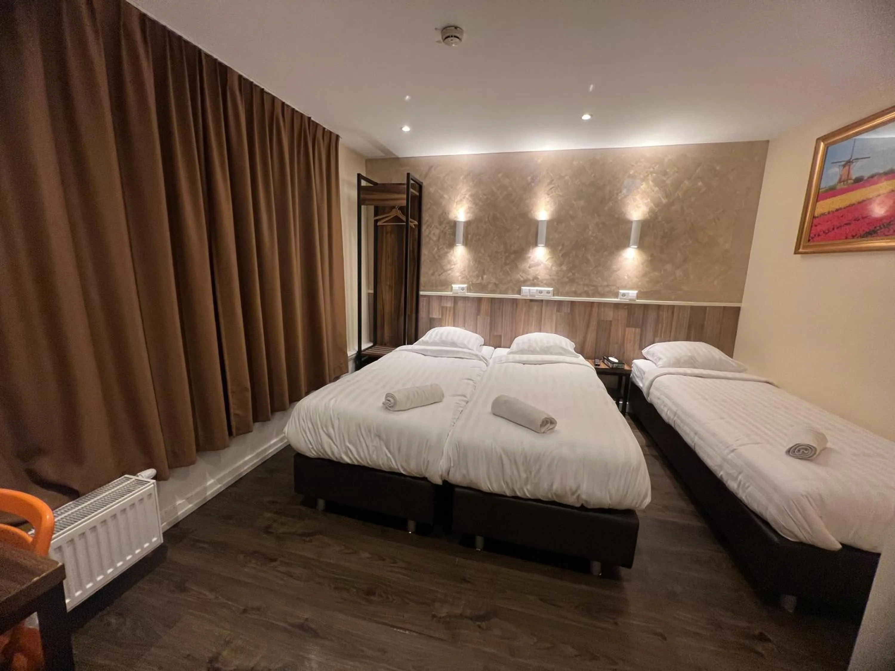 Bed in Orange Tulip Hotel