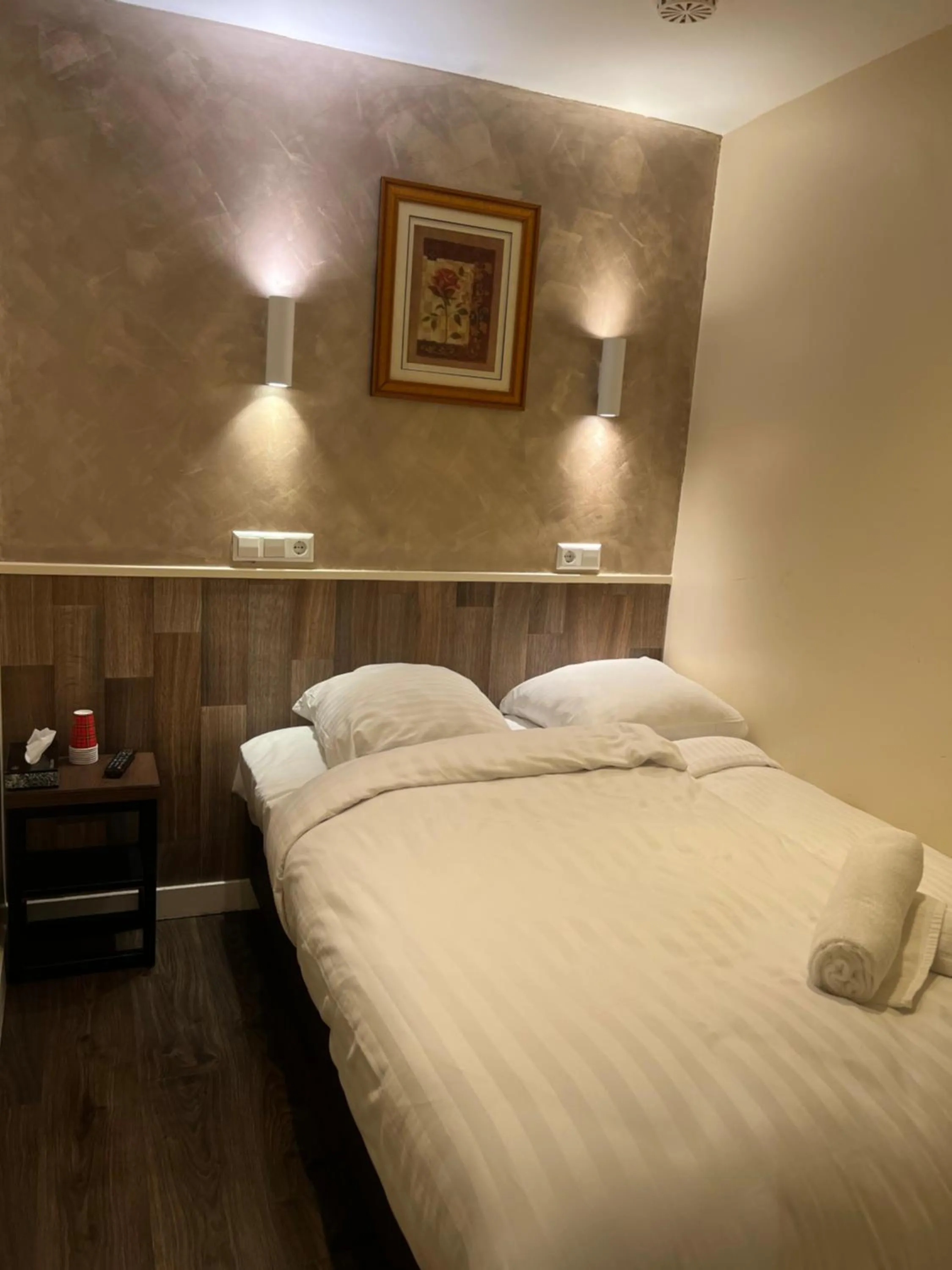 Bed in Orange Tulip Hotel