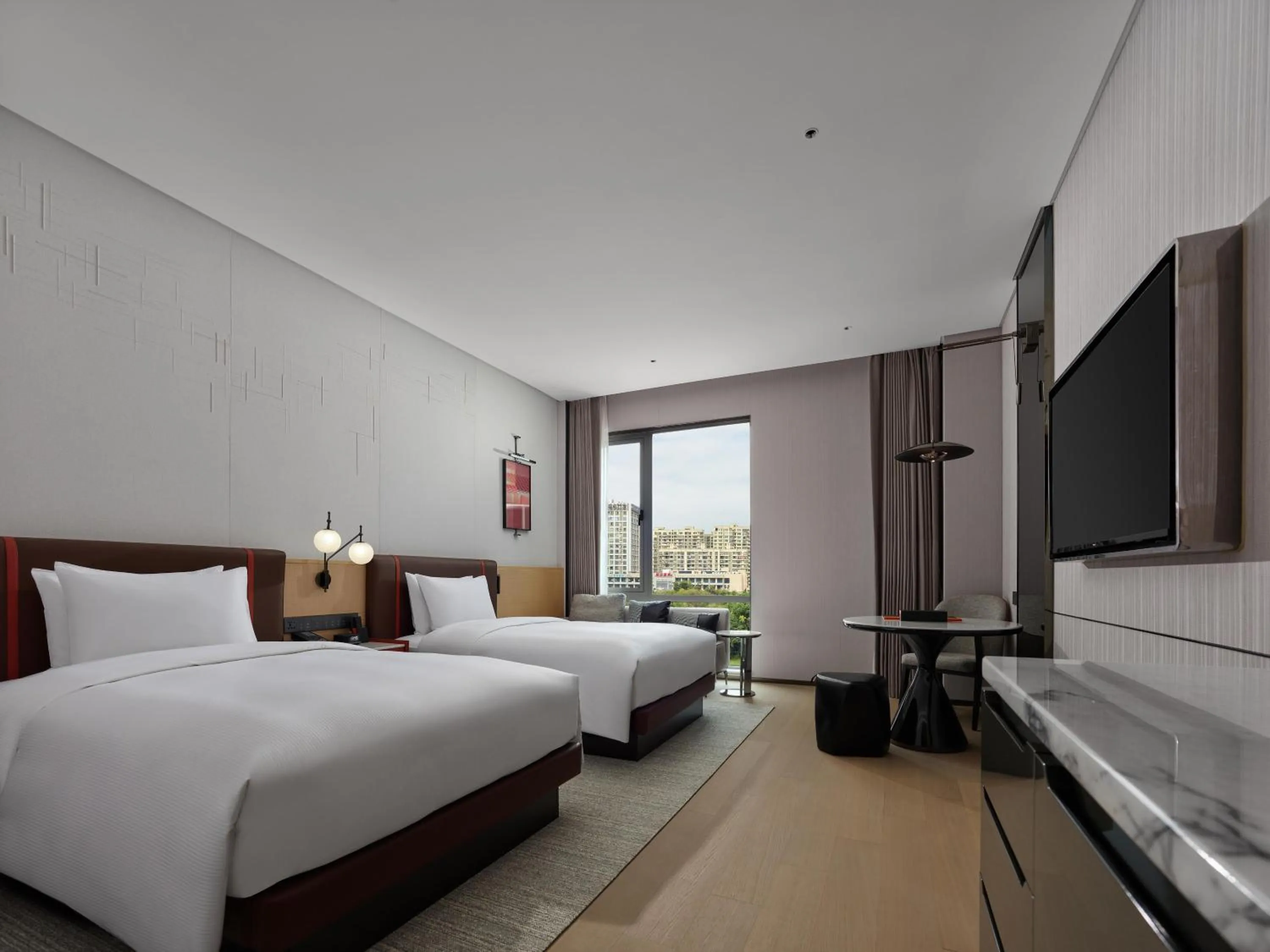 Bed in DoubleTree By Hilton Cangnan