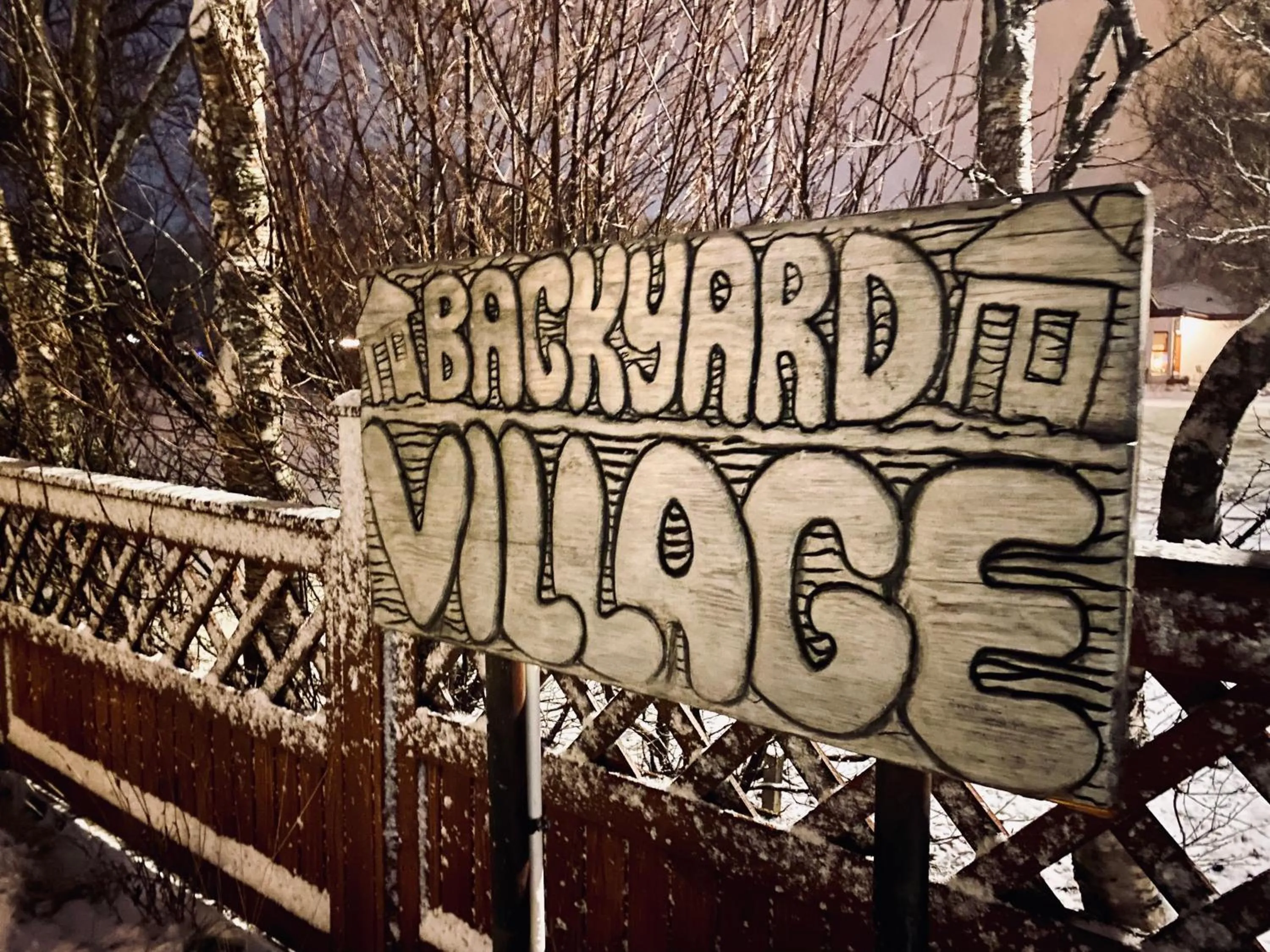 Property logo or sign in Backyard Village