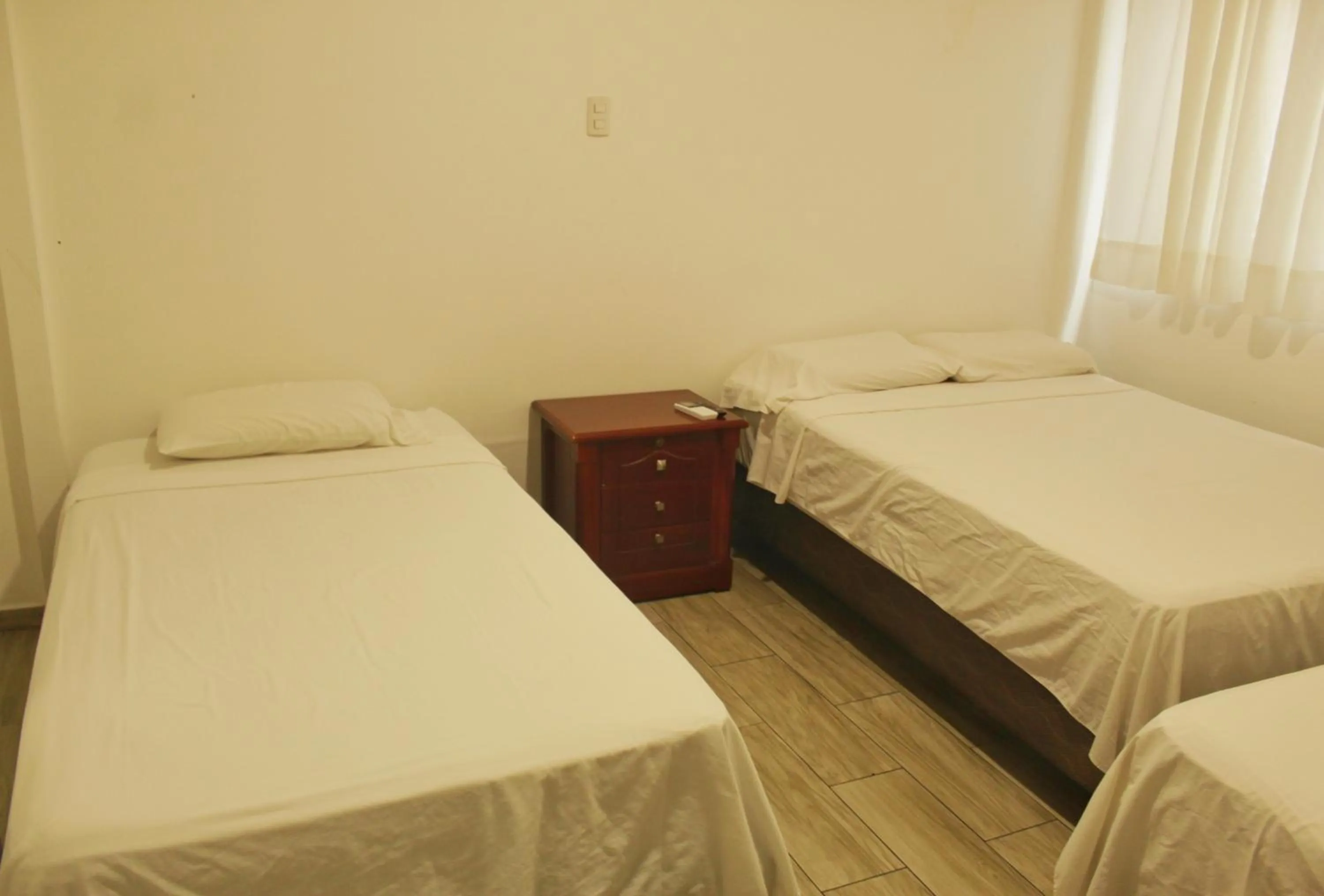 Bed in DC Suites Aeropuerto