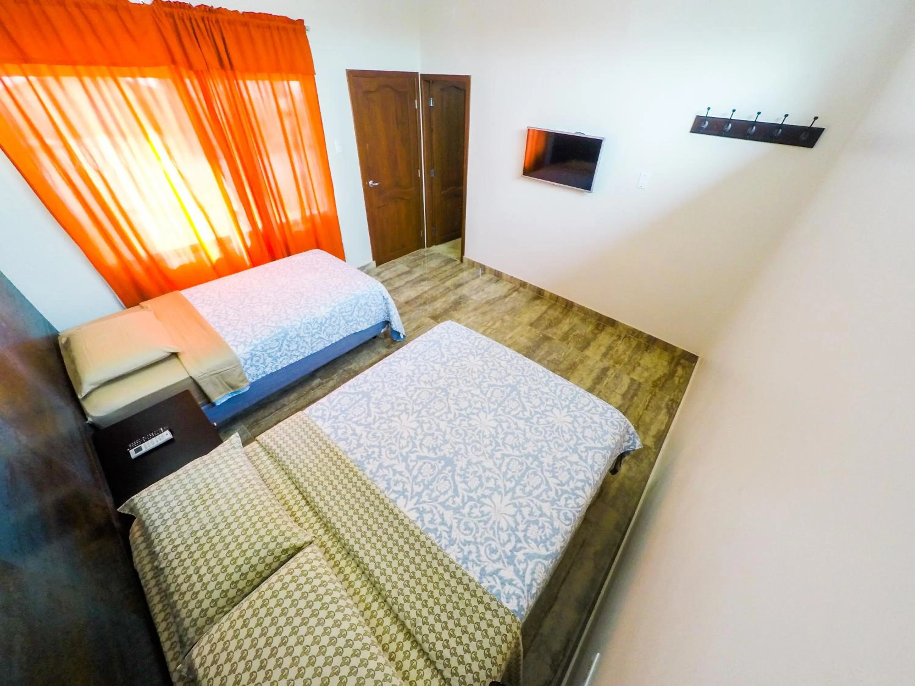 Photo of the whole room, Bed in DC Suites Aeropuerto