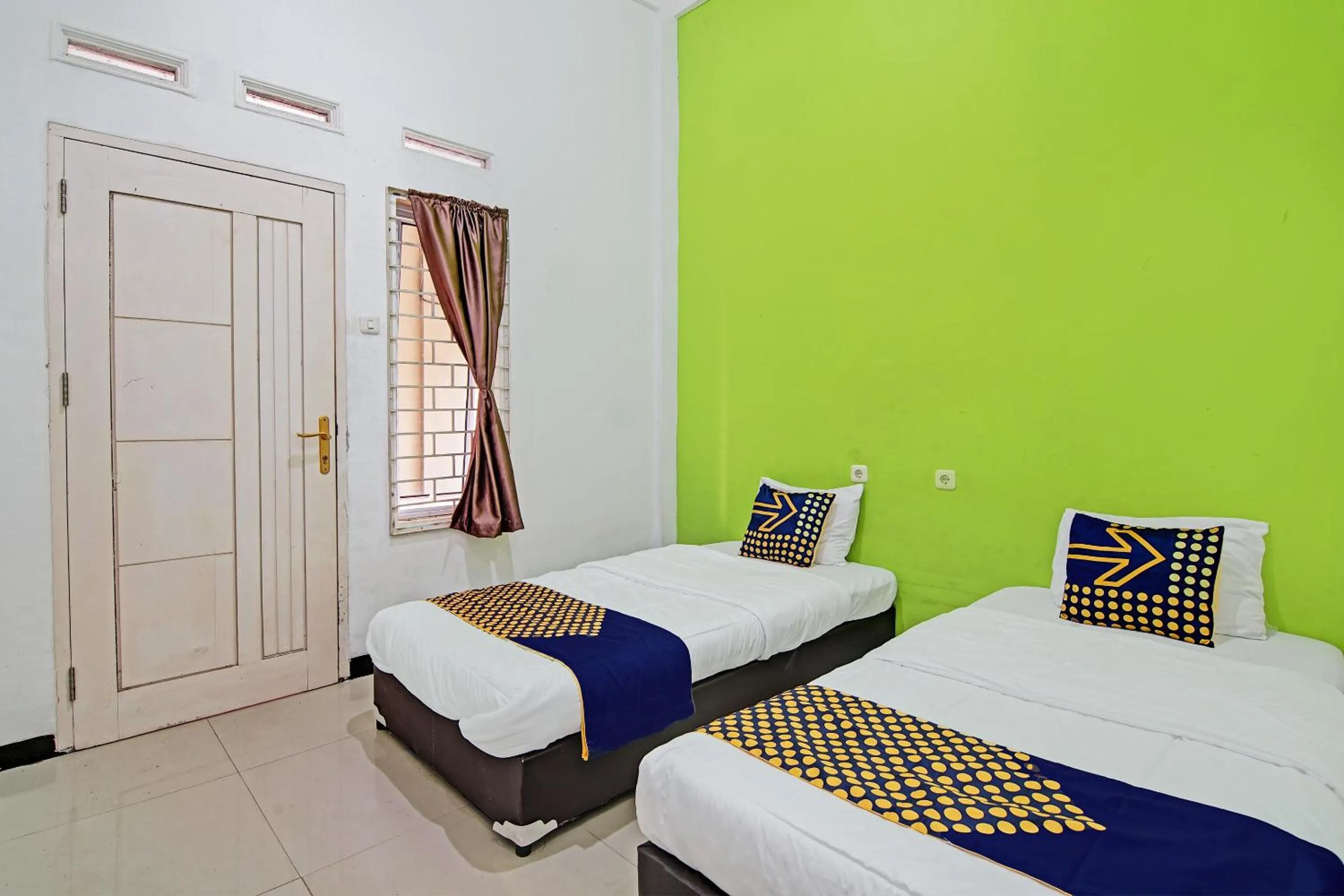 Bedroom, Bed in Hotel O Penginapan Puti SyariahNearBandara Sultan Syarif Kasim II